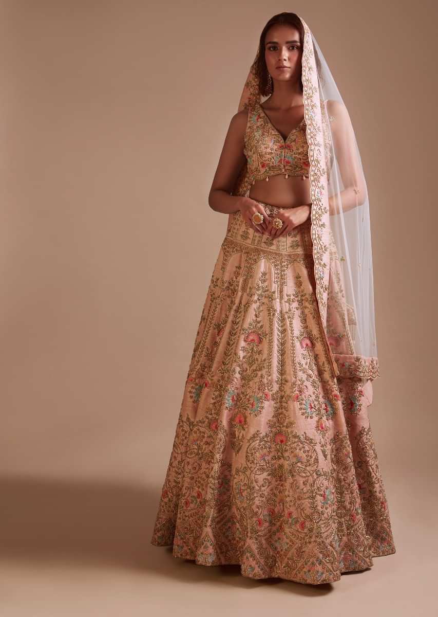 Powder Pink Lehenga Choli With Hand Embossed Embroidery Detailing In Ornate Floral Kalis And Mughal Motifs 