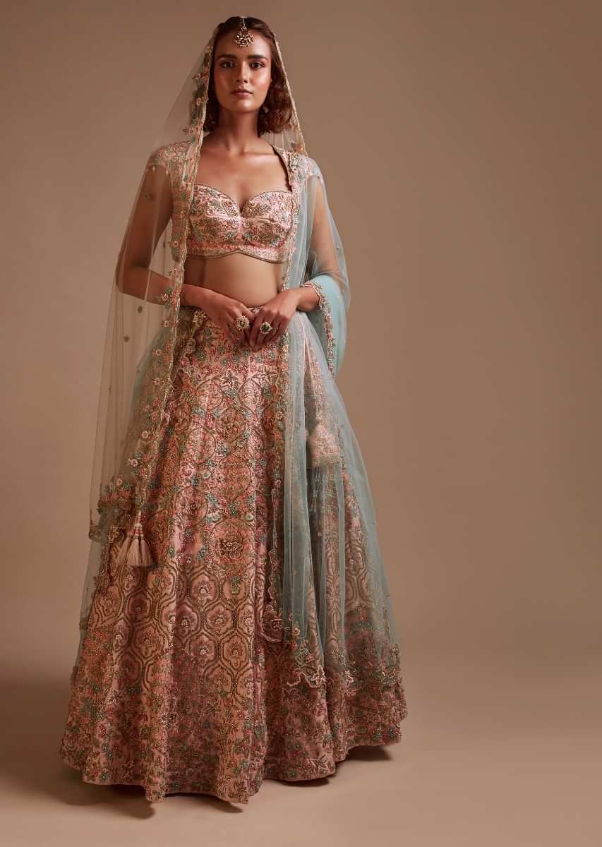 Powder Pink Lehenga In Raw Silk Heavily Hand Embroidered In Floral And Moroccan Motifs Along With 3D Flower Detailing 