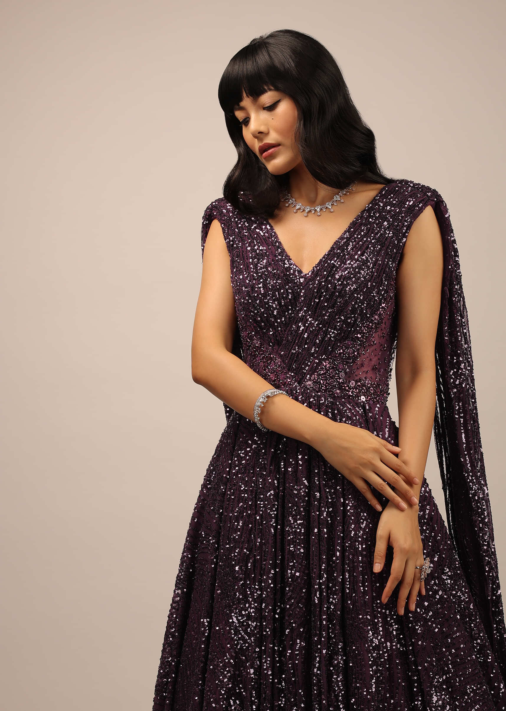 Purple Sleeveless Gown With Low Cut Back And Sequins Work