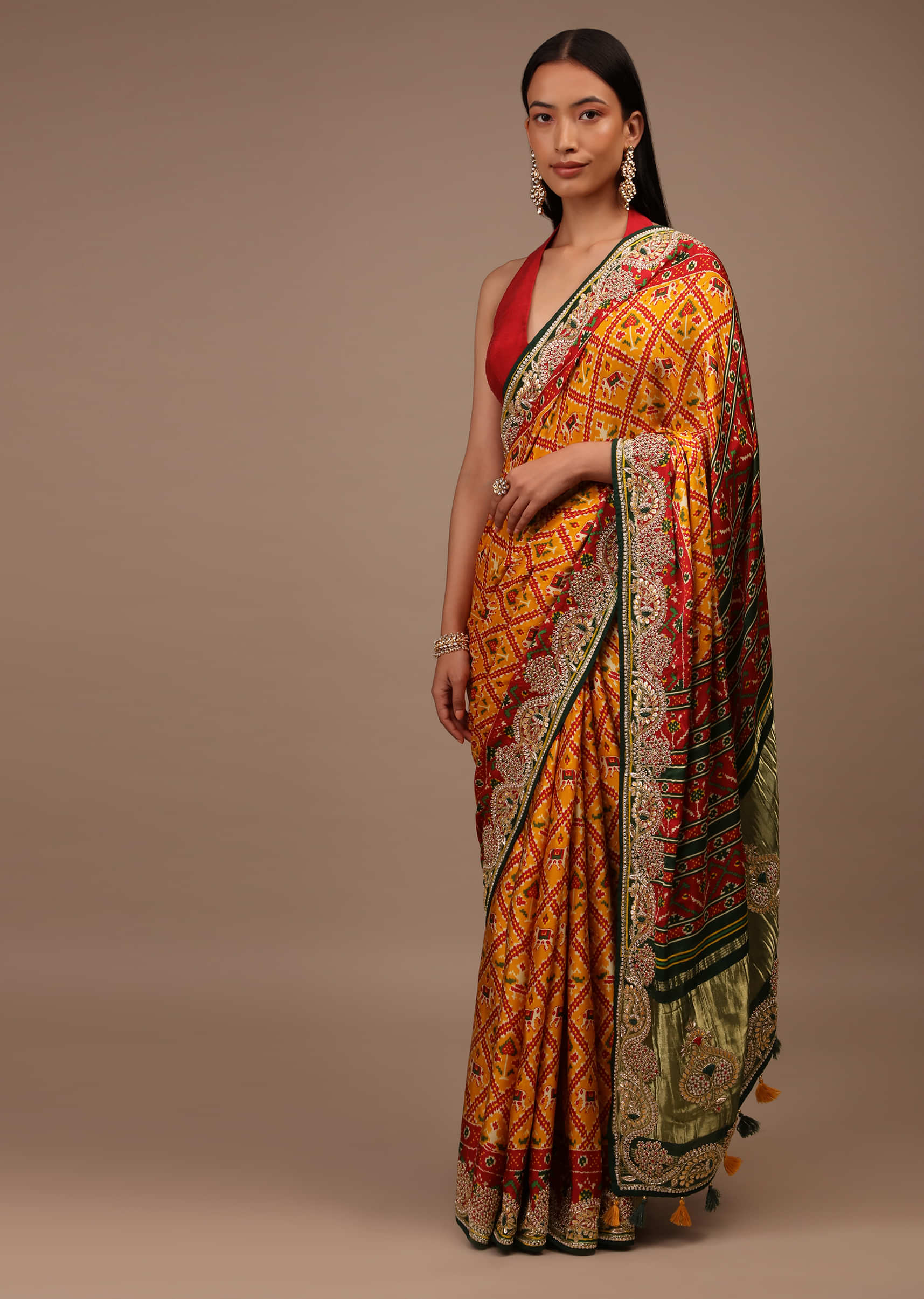 Radiant Yellow Saree In Satin With Multi Colored Patola Print And Gotta Patti Embroidered Border