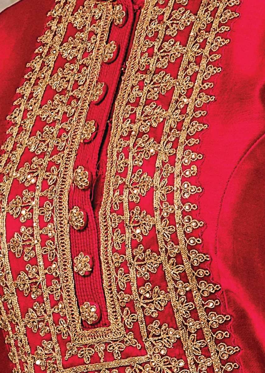 Rani pink lehenga set featuring in raw silk with kundan and cod embroidery