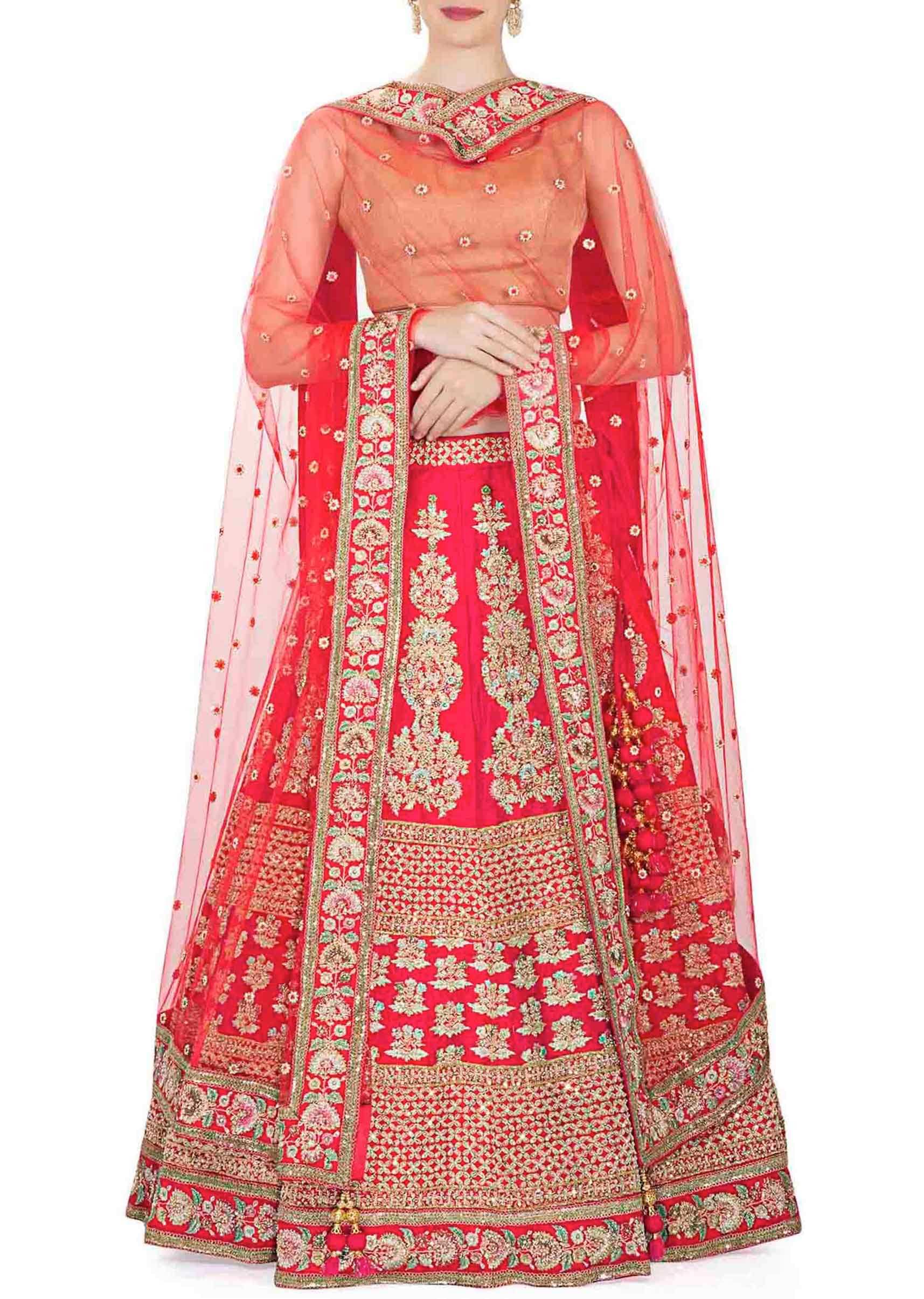 Rani Pink Raw Silk Lehenga, Blouse and Net Dupatta Adorned with Thread Work and Kundan only on Kalki