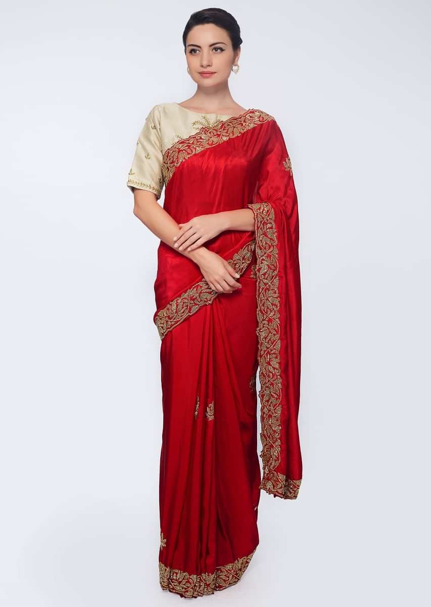 Rani pink satin saree embellished with cut dana embroidered butti and border
