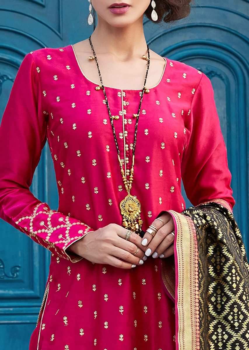 Rani pink straight suit in zari embroidery along with black brocade dupatta