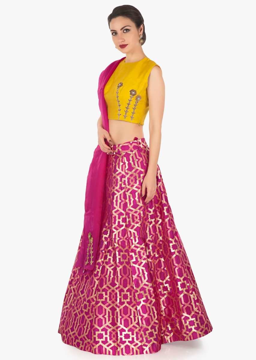 Rani pink lehenga in brocade silk with contrast yellow raw silk blouse in zardosi work only on Kalki