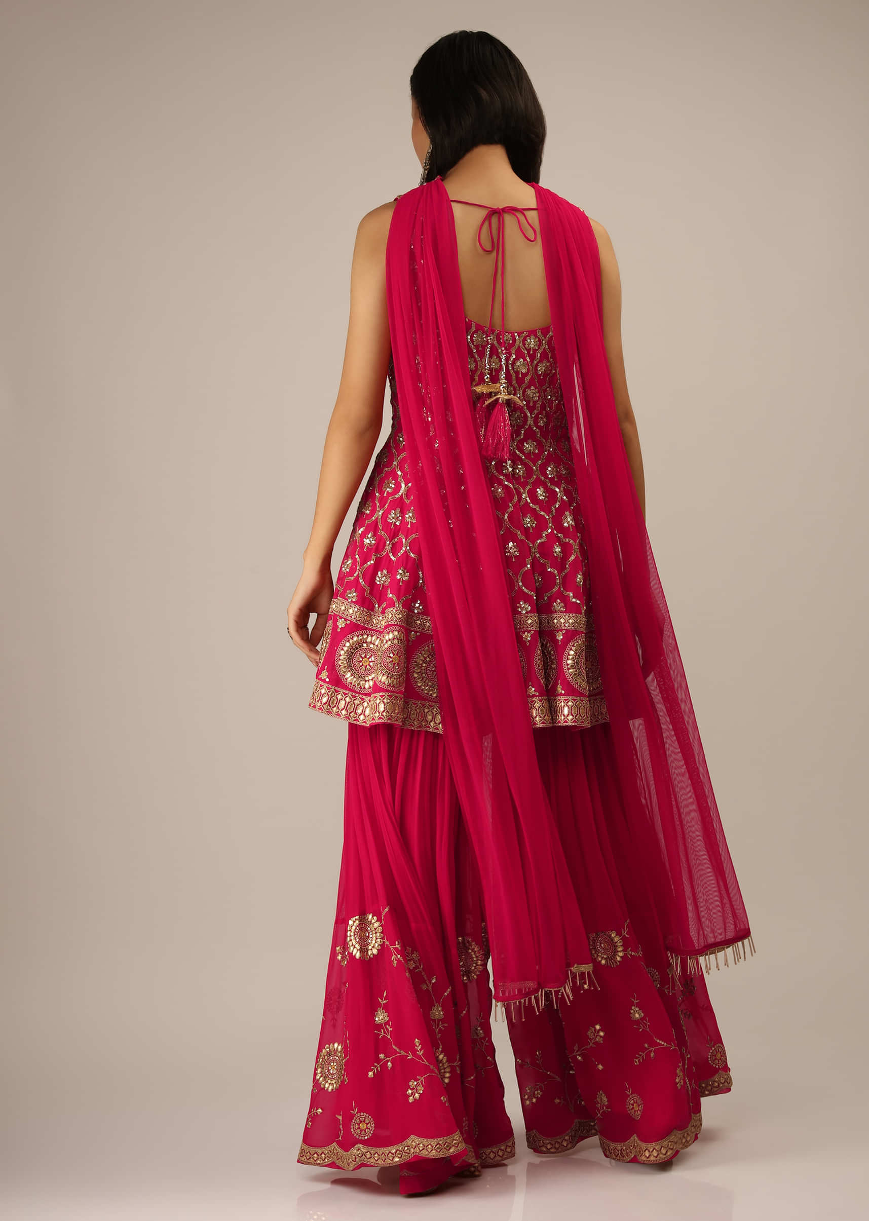 Rani Pink Sharara And Peplum Suit With Moroccan Jaal Embroidery And Gotta Highlights