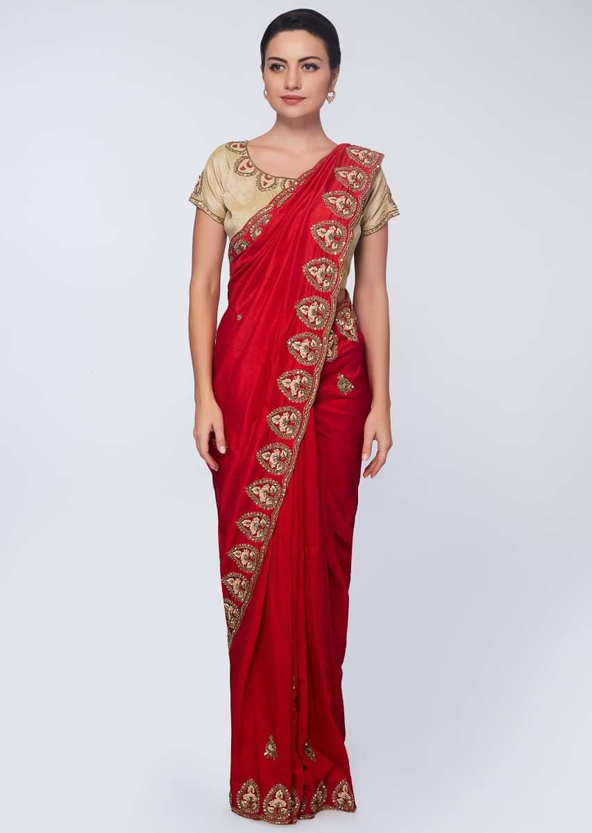 Red cotton silk saree in embroidered butti and border