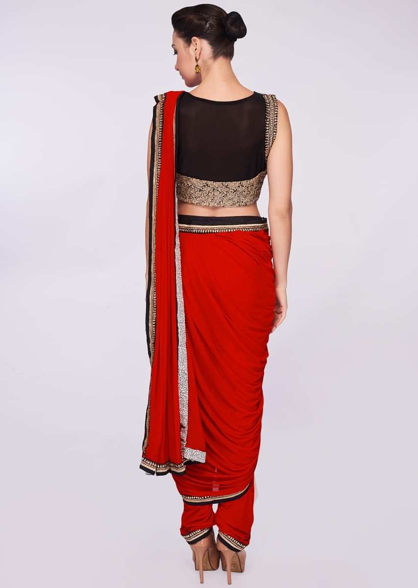 Red lycra dhoti saree paired with fancy fabric blouse 