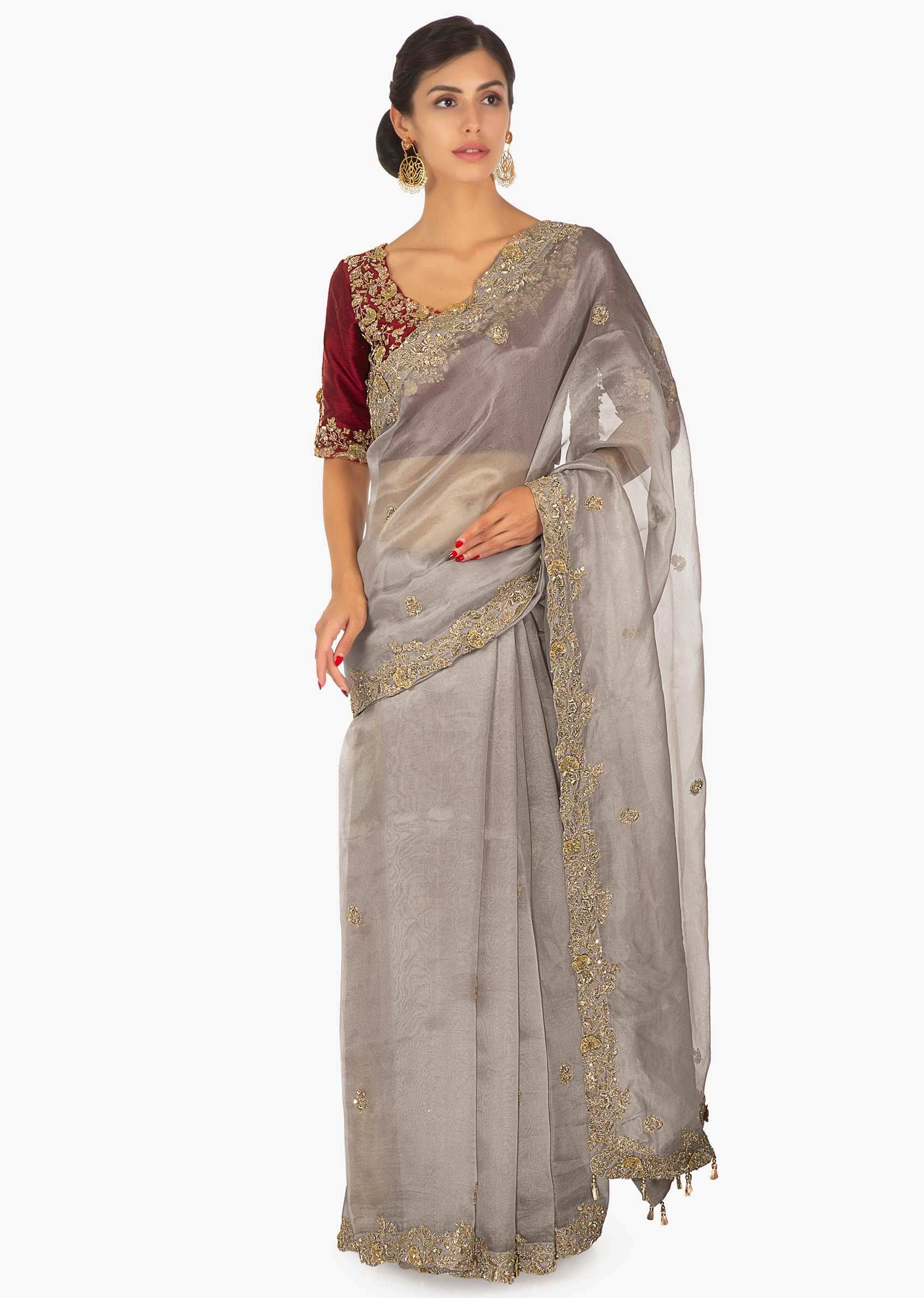 Red raw silk embellished blouse  paired with grey organza saree