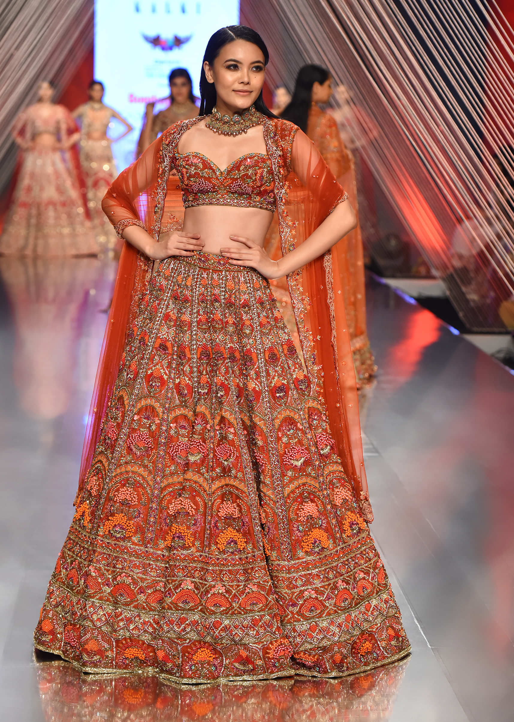 Red Lehenga With A Crop Top In Royal Heritage Embroidery, Crop Top Comes In Sleeveless With A Sweetheart Neckline