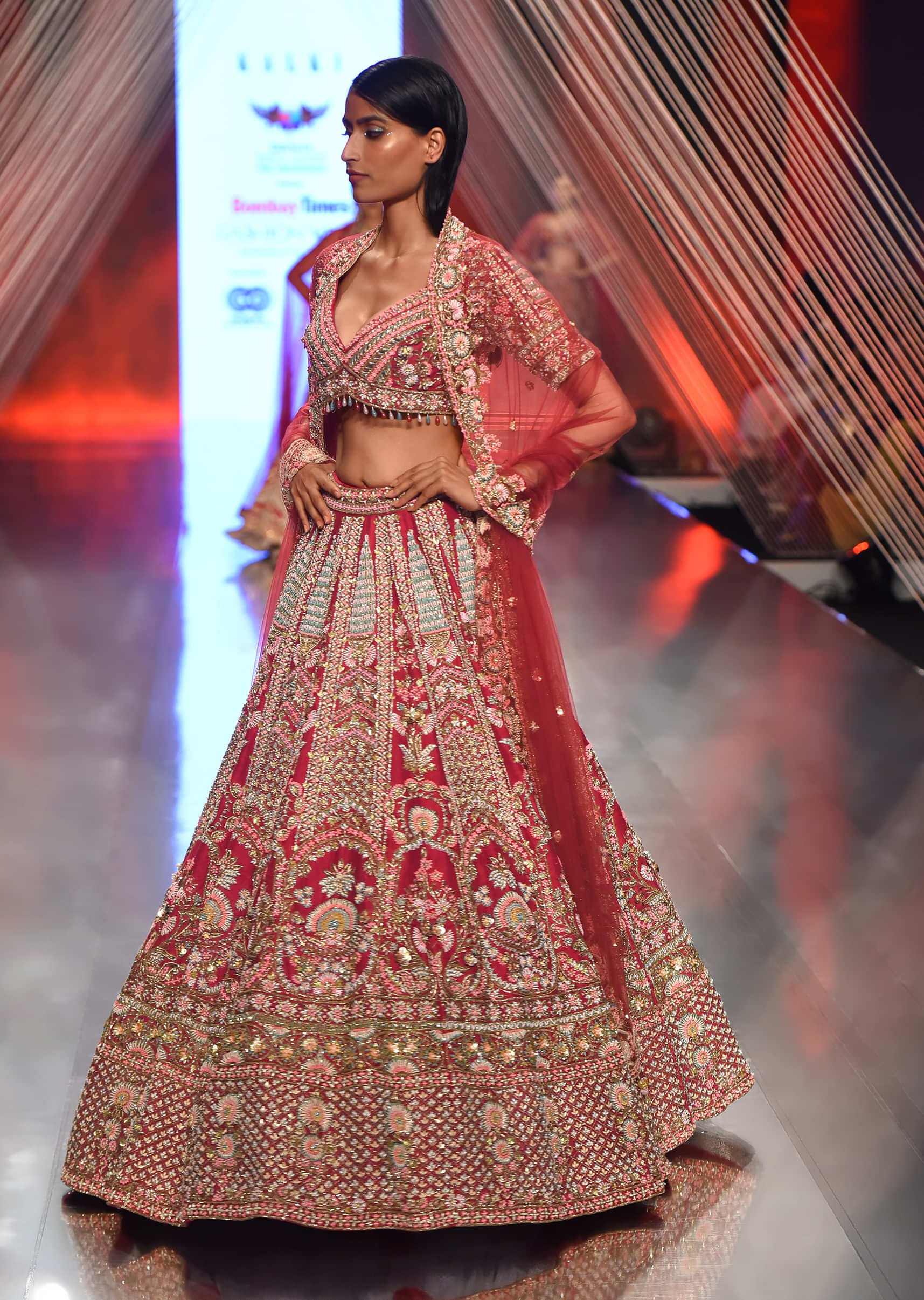Red Lehenga Choli In Raw Silk With Hand Embroidered Multicolored Heritage Kalis And Embossed Floral Motifs