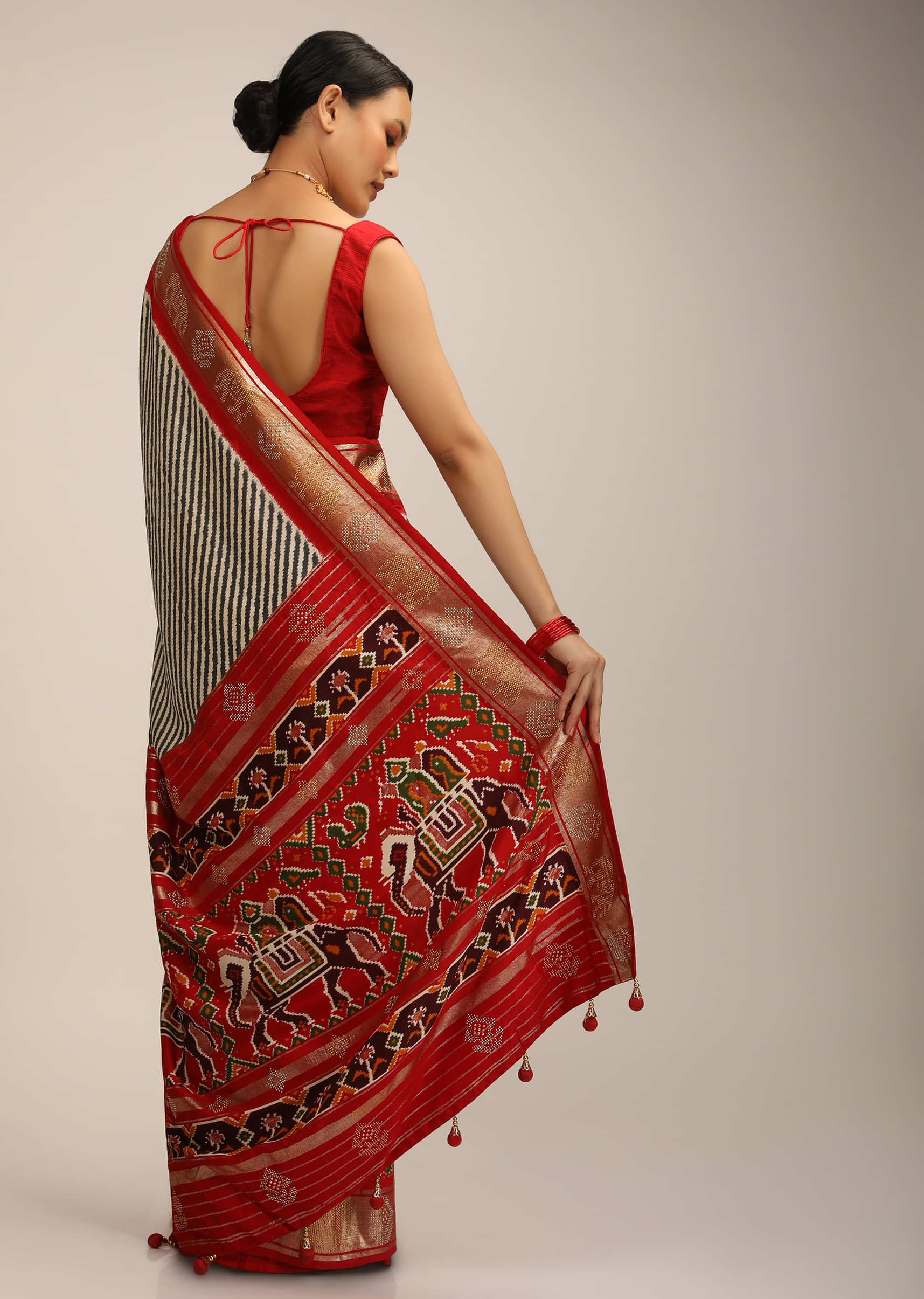 Red Saree In Silk With Multi Colored Patola Print And Diagonal Stripes