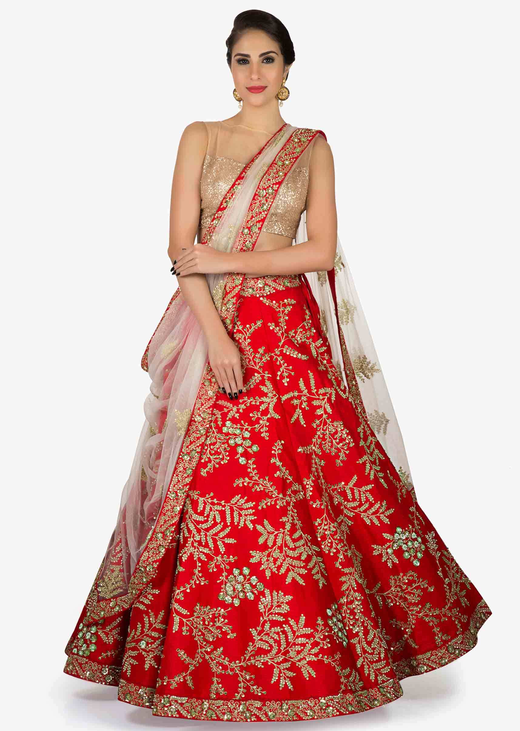 Red Silk Lehenga teamed up with Off White Net dupatta with Kundan and Zari Embellishments Only on Kalki