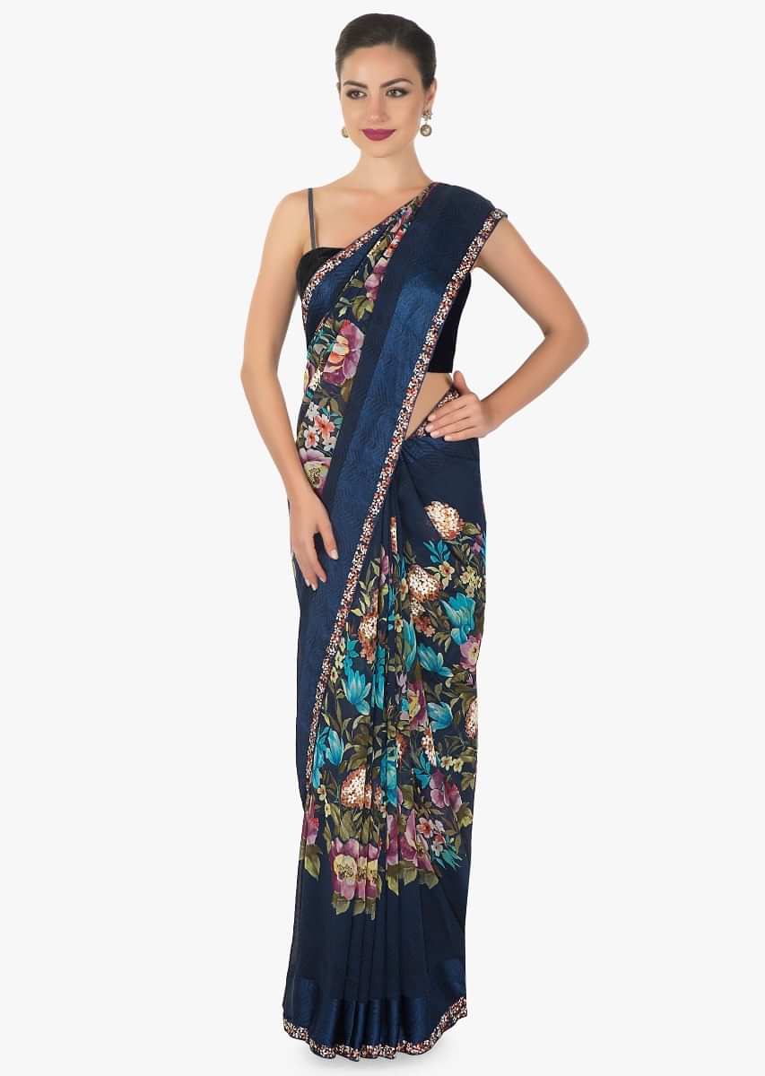 Royal blue georgette saree with multi colour floral print and   a rich persion blue silk border