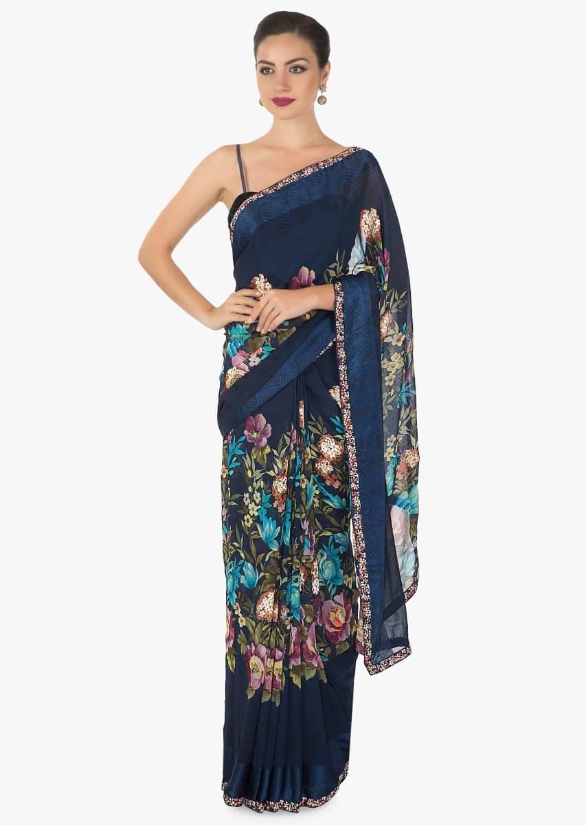 Royal blue georgette saree with multi colour floral print and   a rich persion blue silk border