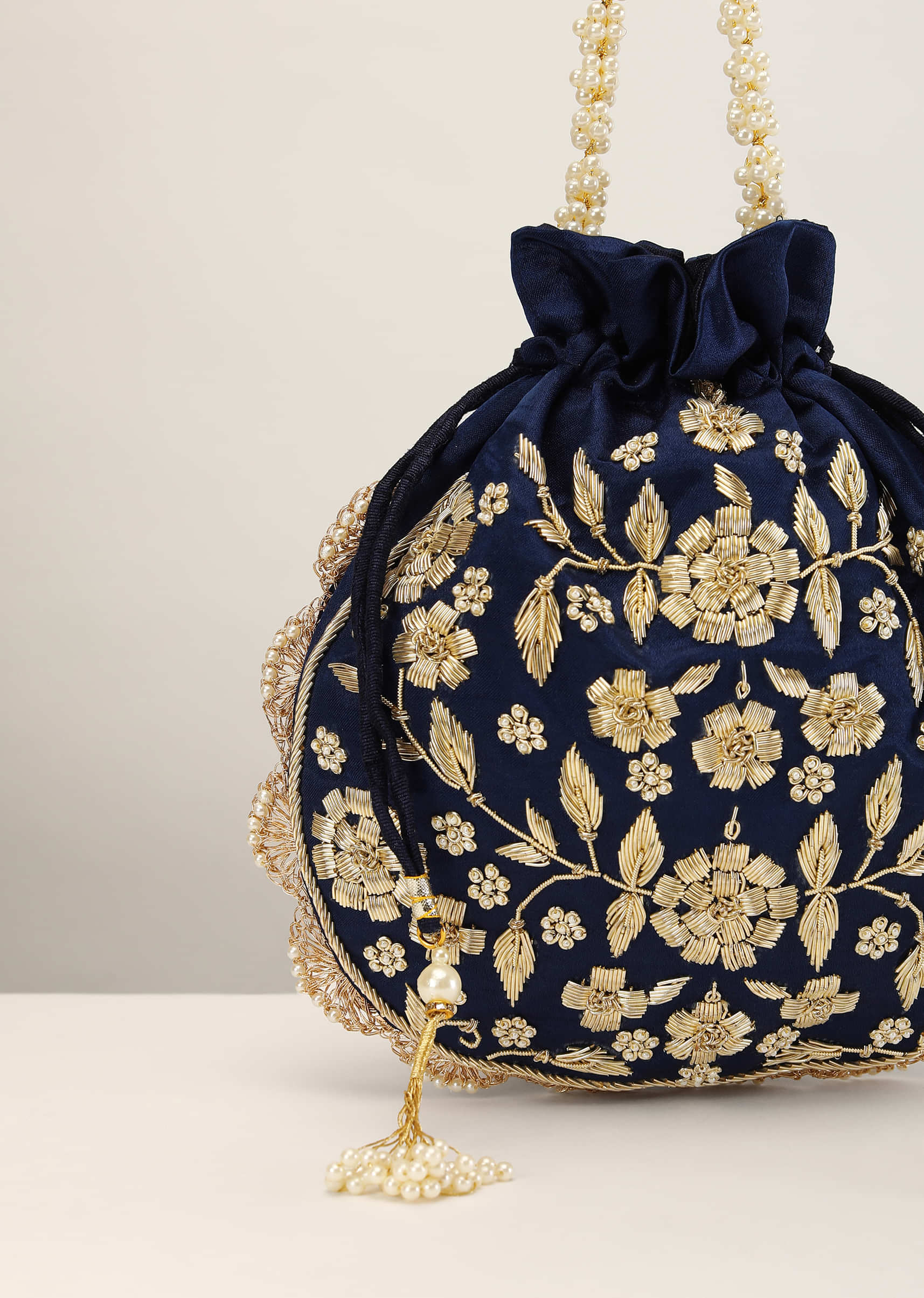 Royal Blue Potli In Satin With Hand Embroidery Detailing Using Zardosi And Moti Embroidered Floral Design