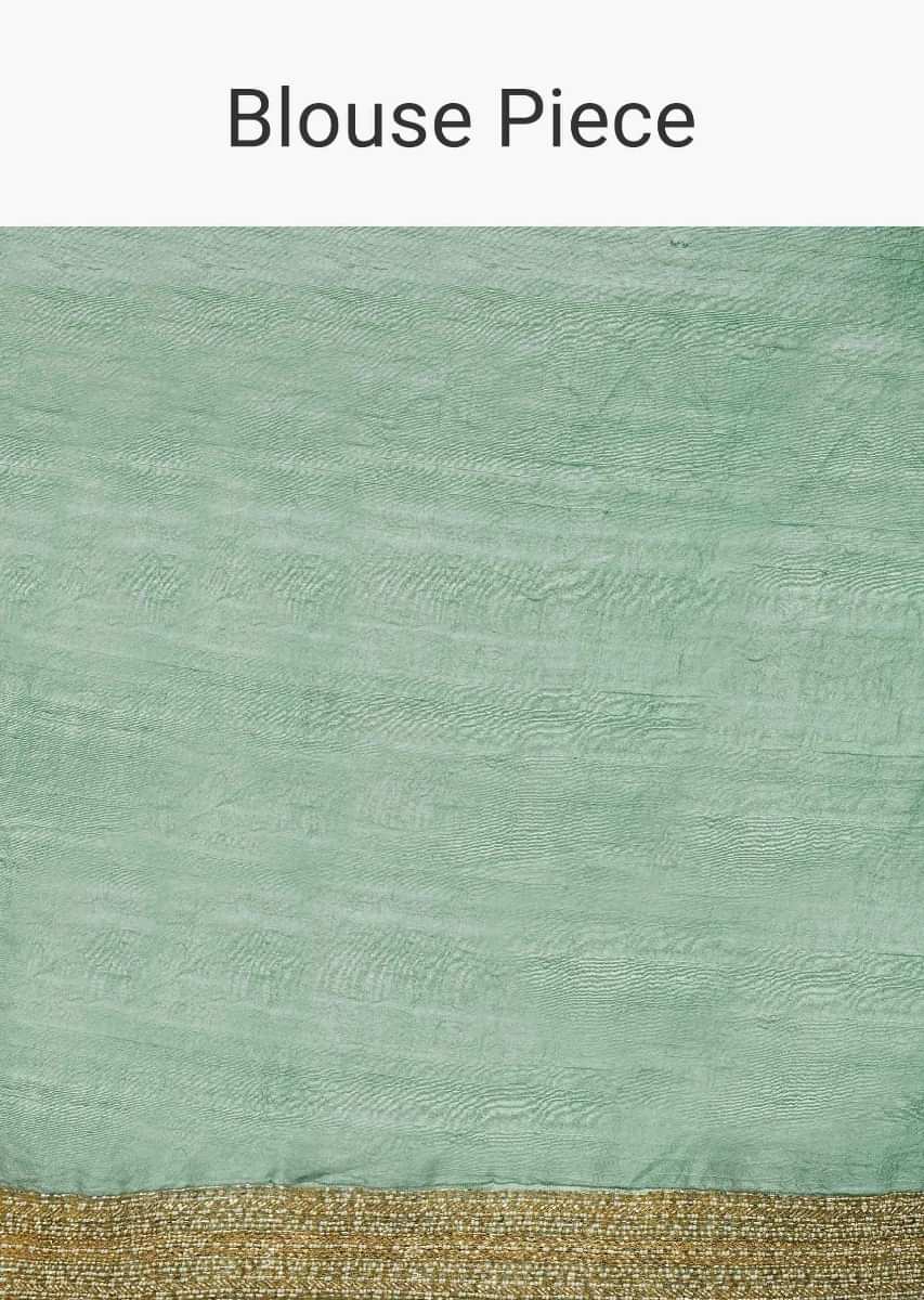 Sage green half and half saree featuring in satin and net 