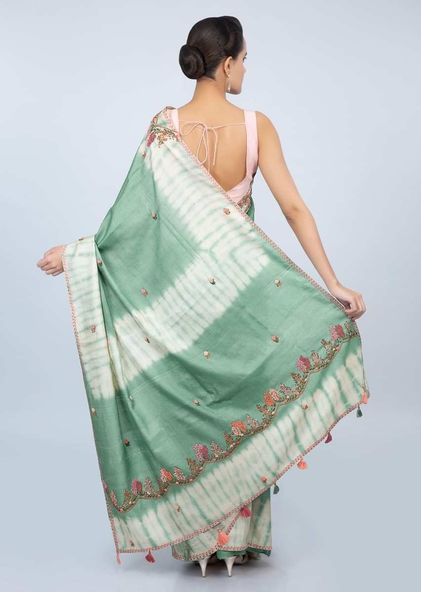 Sage green tussar silk saree with thread embroidered butti and batik print only on kalki