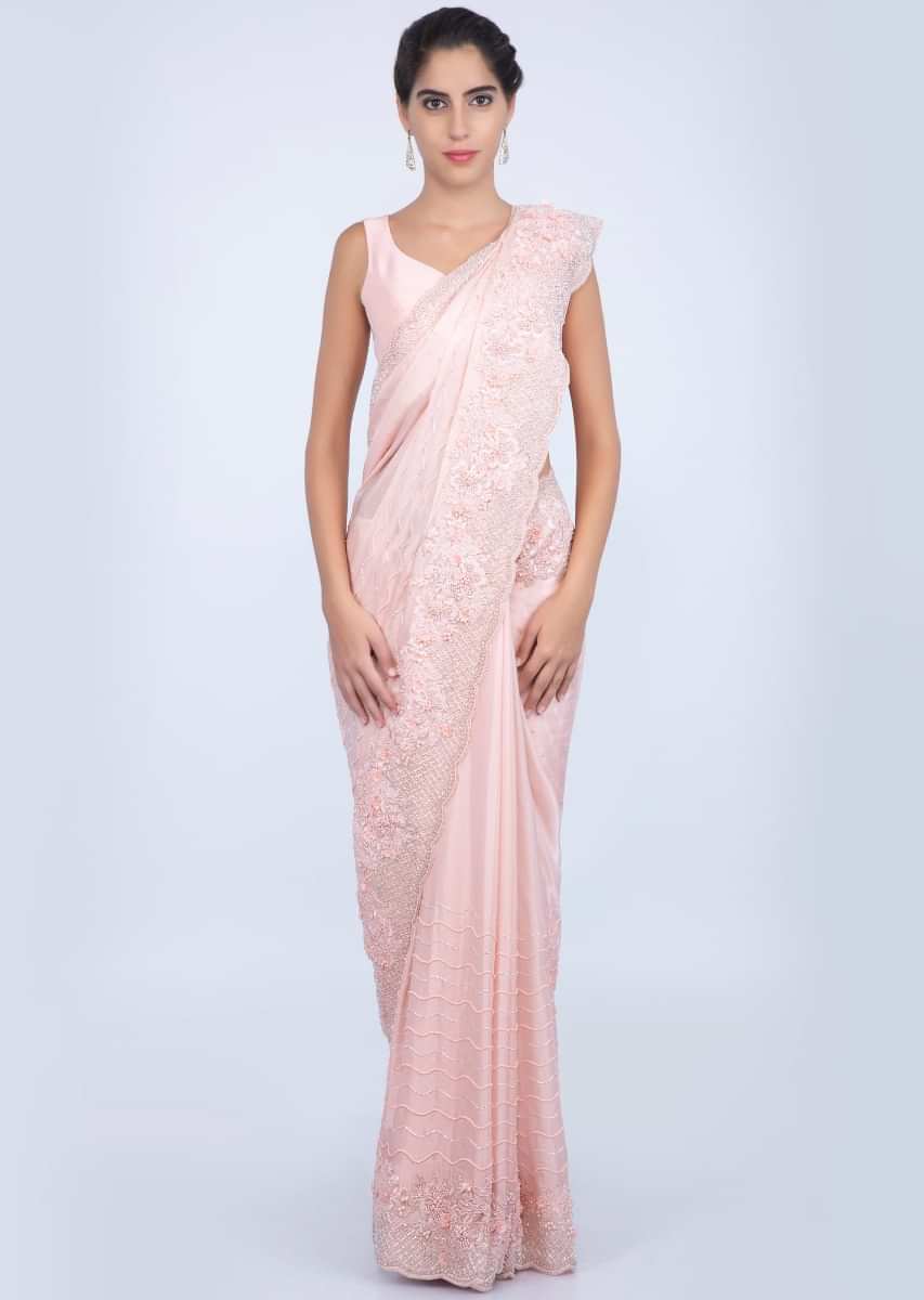 Salmon peach heavy embroidered satin saree with stone, pearl and cut dana embroidery only on kalki