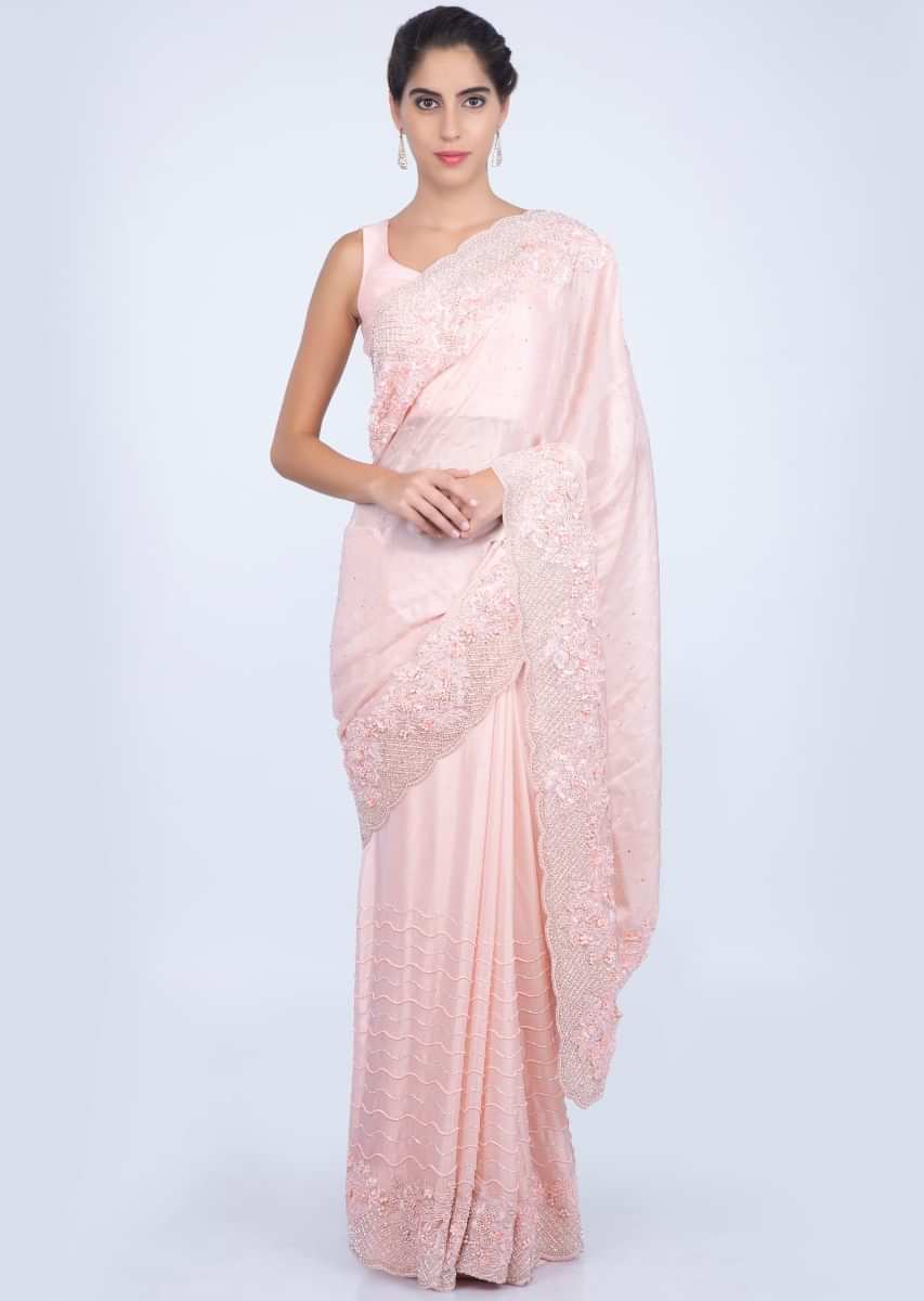 Salmon peach heavy embroidered satin saree with stone, pearl and cut dana embroidery only on kalki