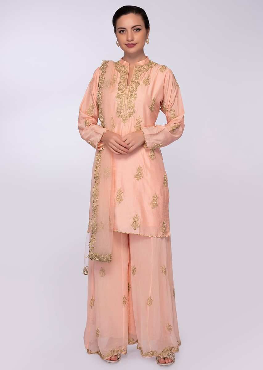 Salmon pink cotton suit in zari and moti embroidery and butti