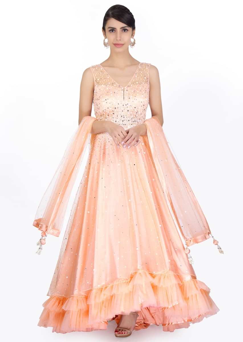 Salmon pink net anarkali gown in mirror, stone and flat pearls