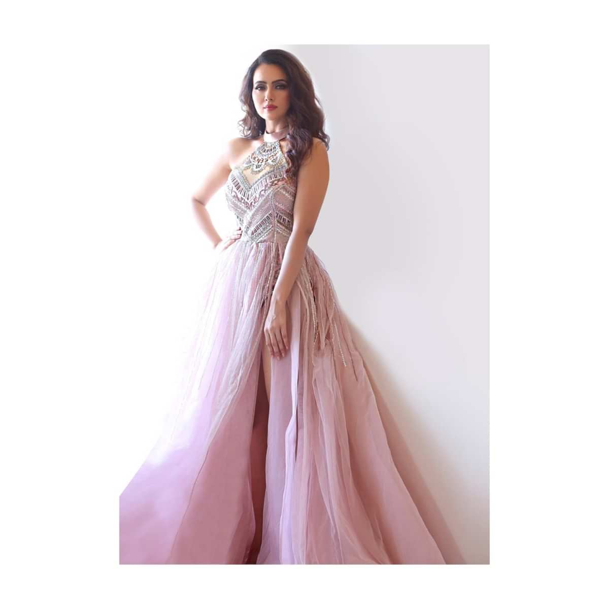 Sana Khan in Kalki mauve pink body suit style embroidered flared net gown with side slit