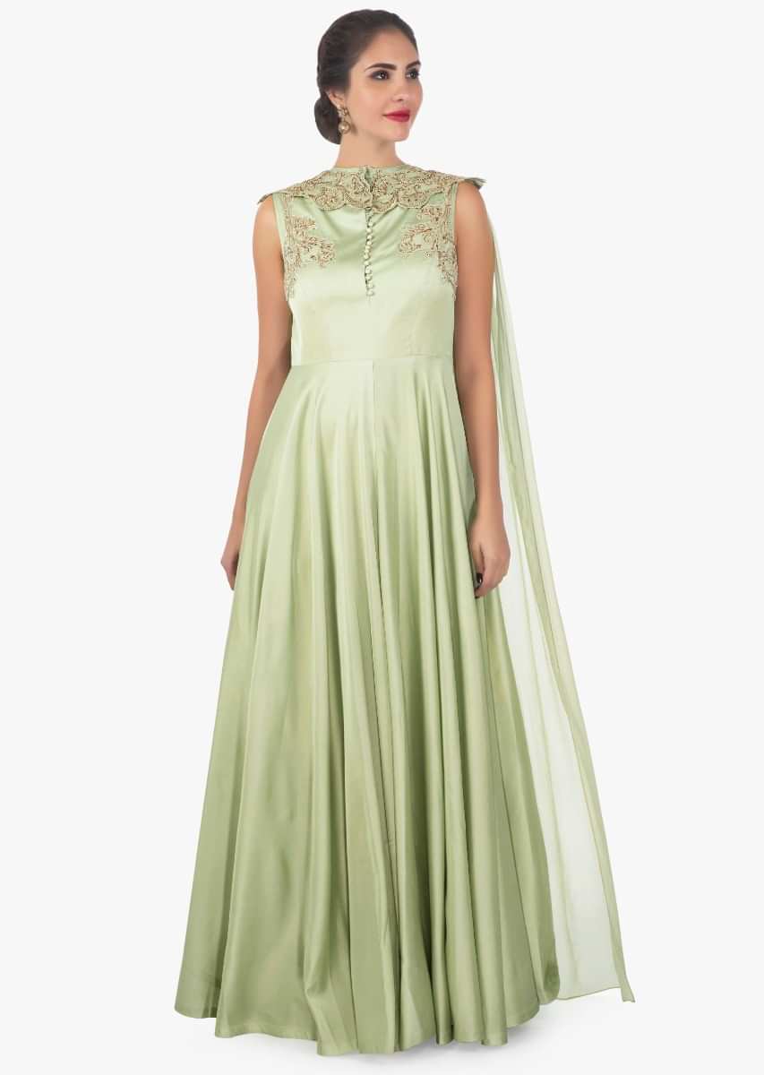 Sandal door green georgette satin gown enhanced with a attachable cape only on Kalki