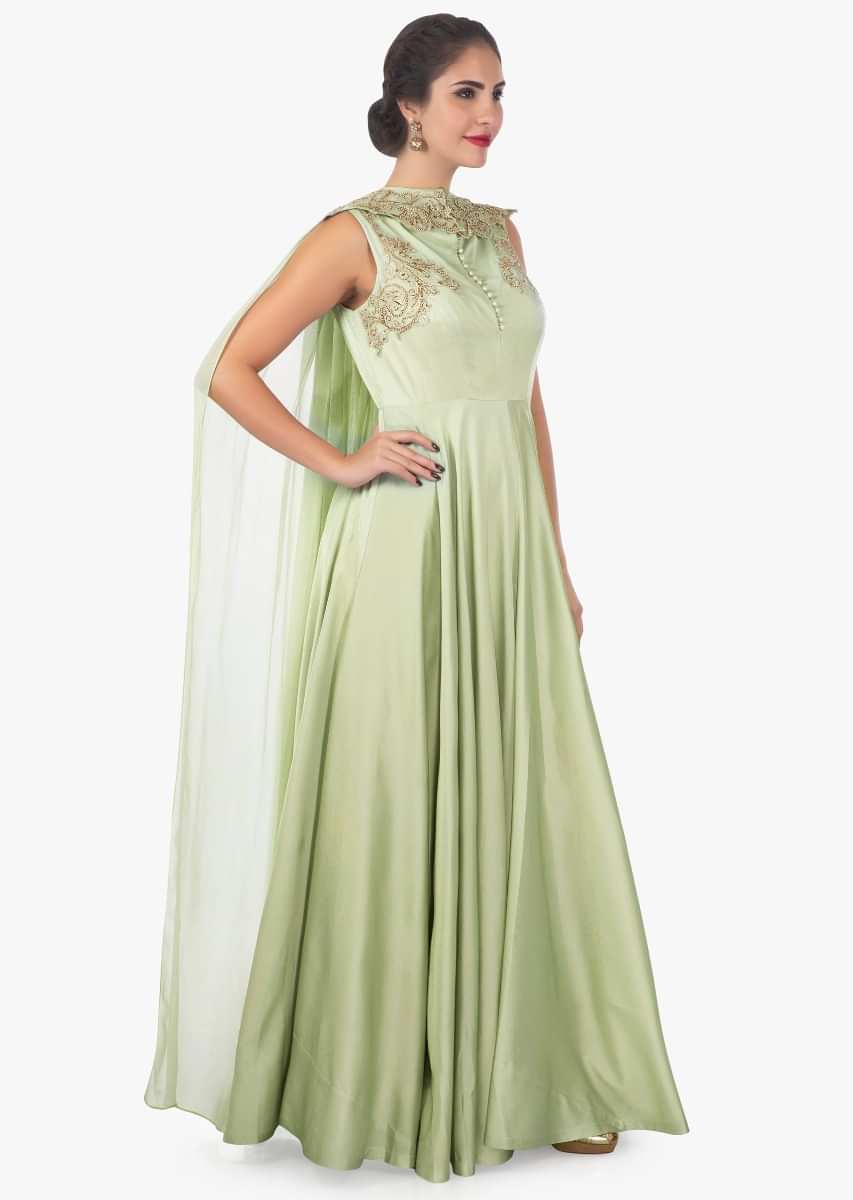Sandal door green georgette satin gown enhanced with a attachable cape only on Kalki