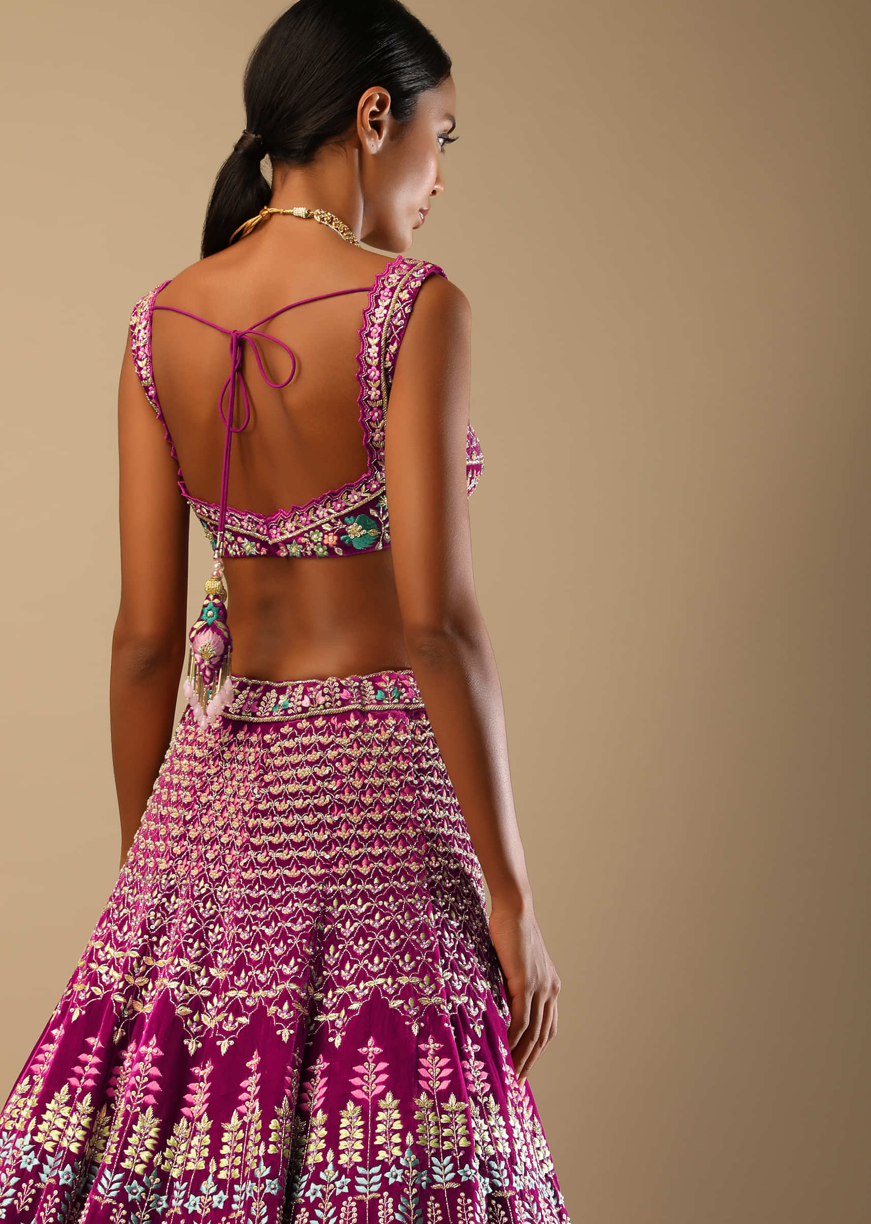 Sangria Lehenga Choli In Velvet With Colorful Resham And Sequin Flowers And Golden Cut Dana Adorned Moroccan Motifs 