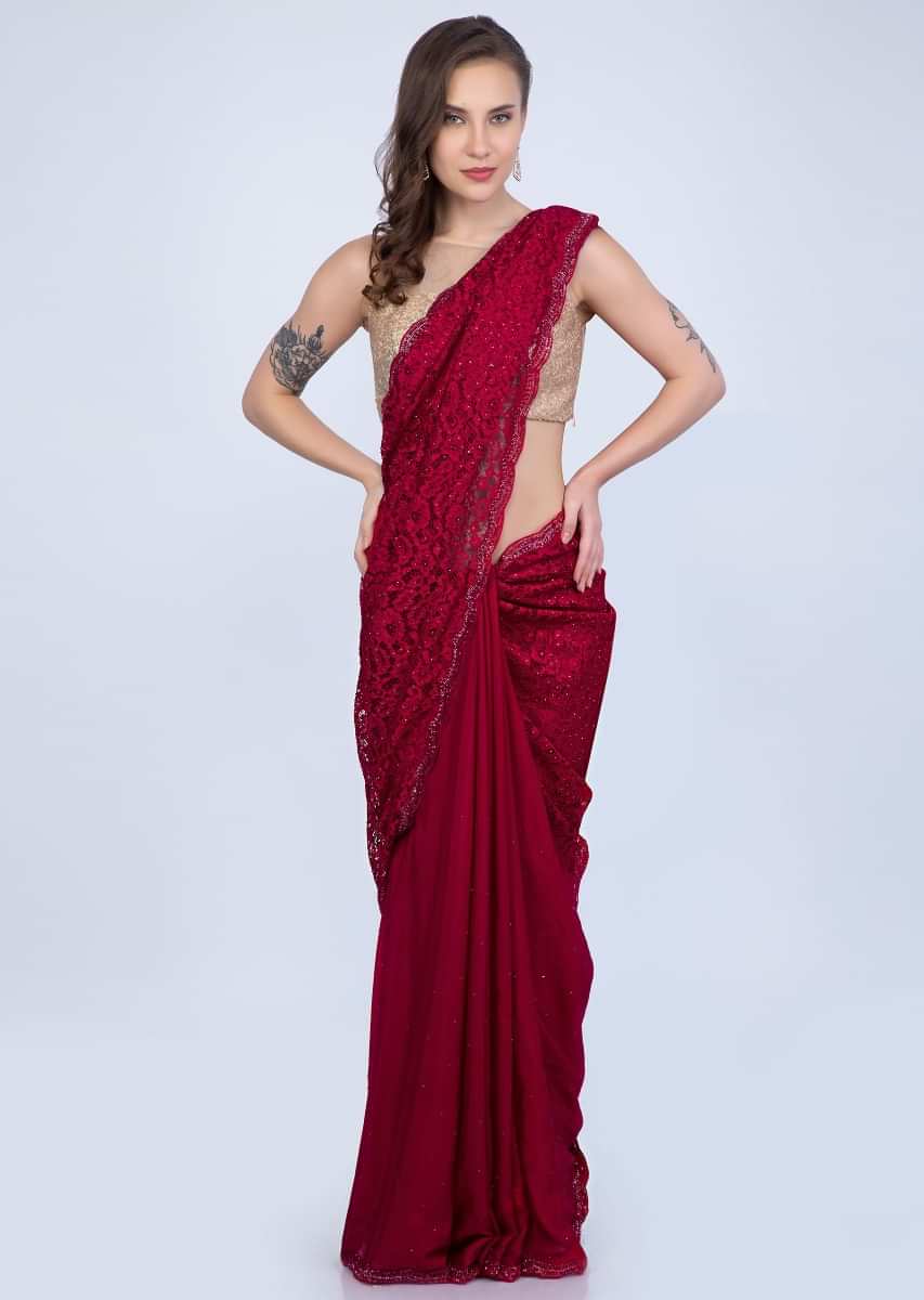 Scarlet red half an half saree featuring in chantilly lace and satin chiffon only on Kalki