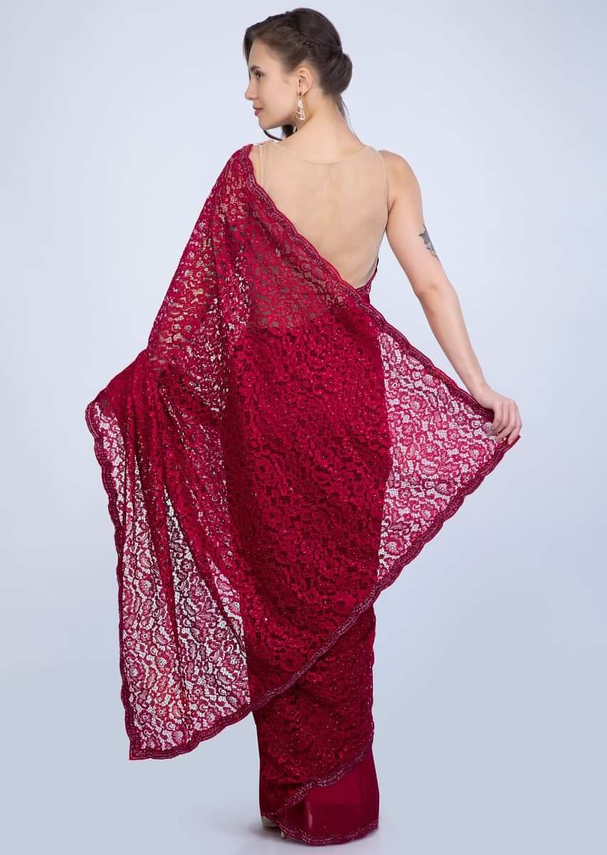 Scarlet red half an half saree featuring in chantilly lace and satin chiffon only on Kalki