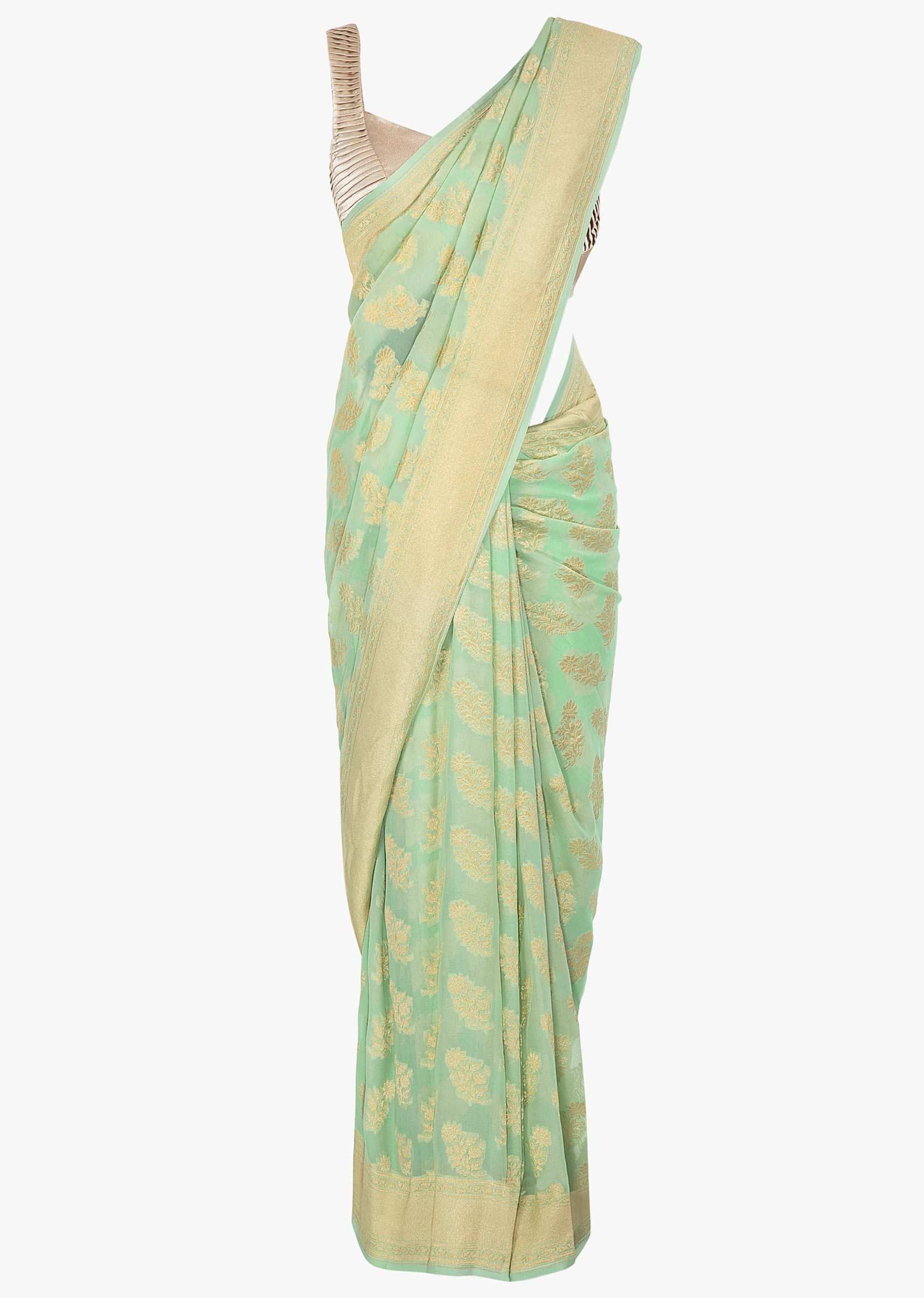Sea foam green georgette saree in floral weaved butti and border