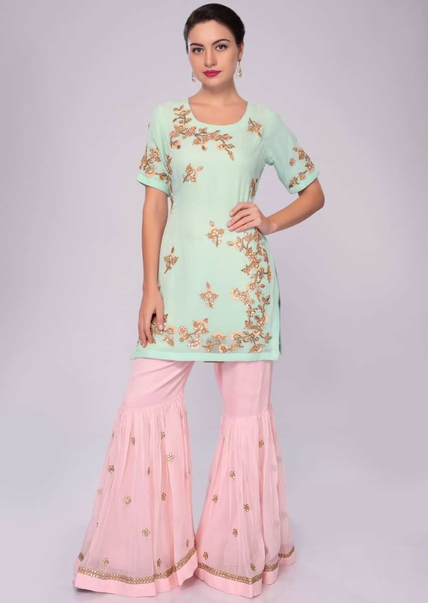 Sea green embroidered suit with pink sharara and net dupatta