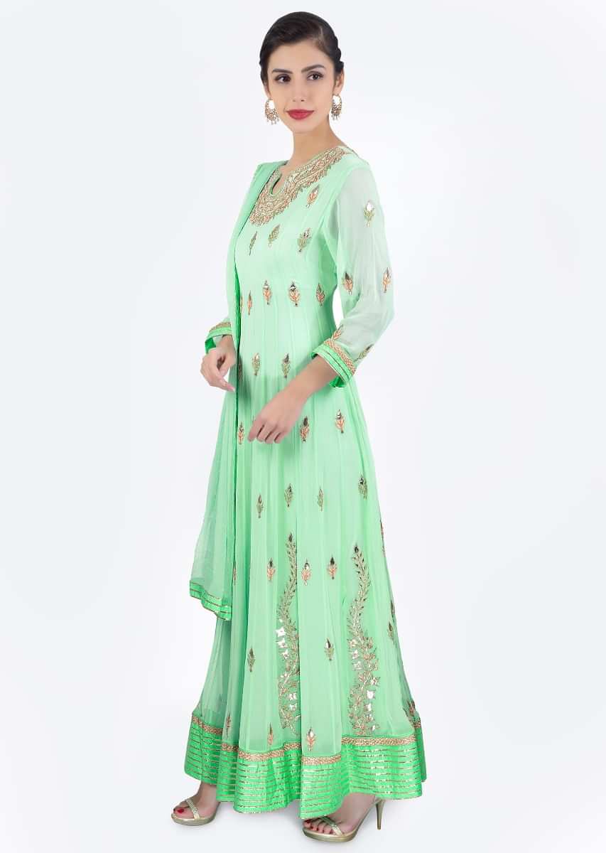 Sea green georgette anarkali dress paired with matching chiffon net dupatta 