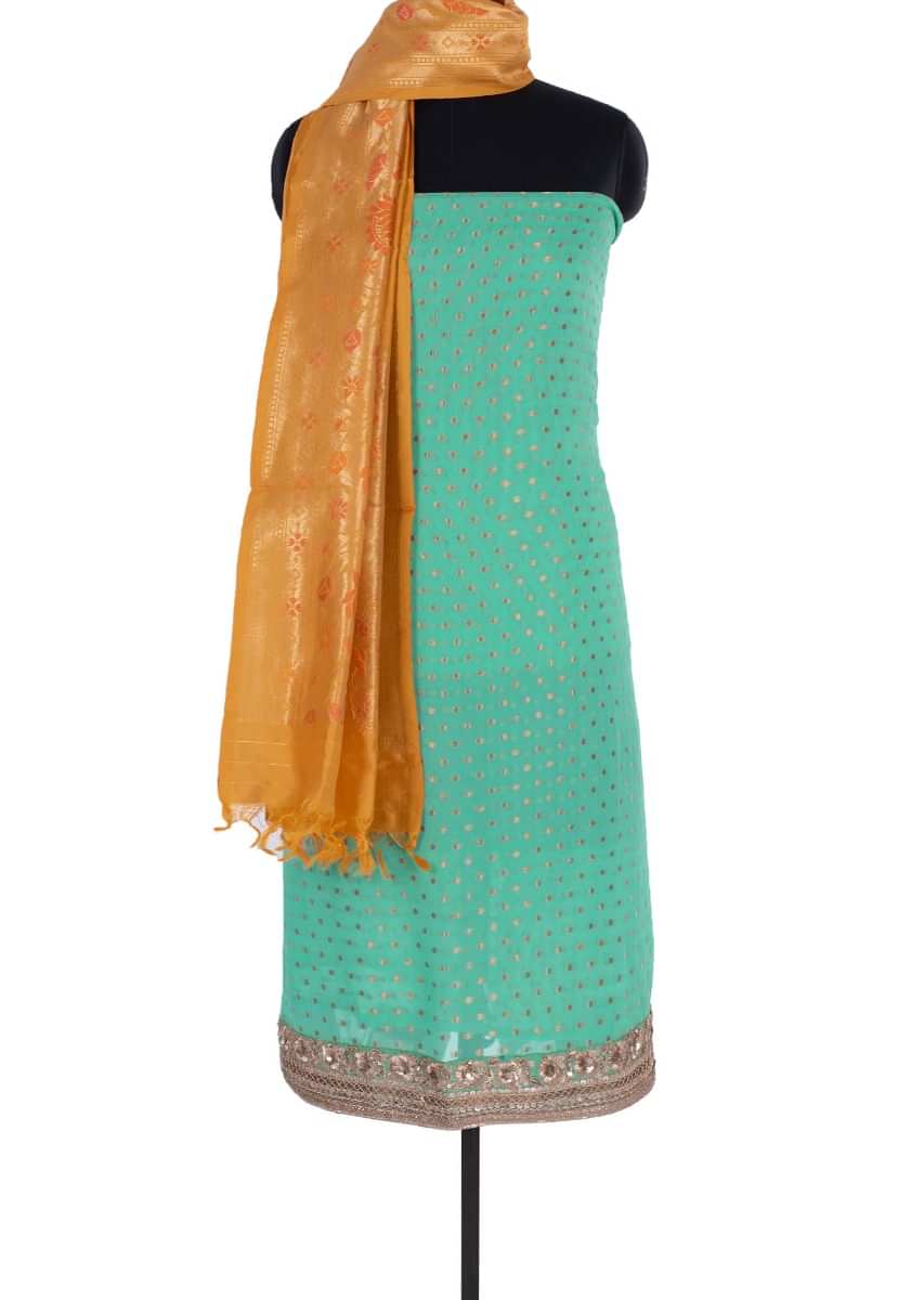 Sea green georgette unstitch suit with weaved butti only on Kalki