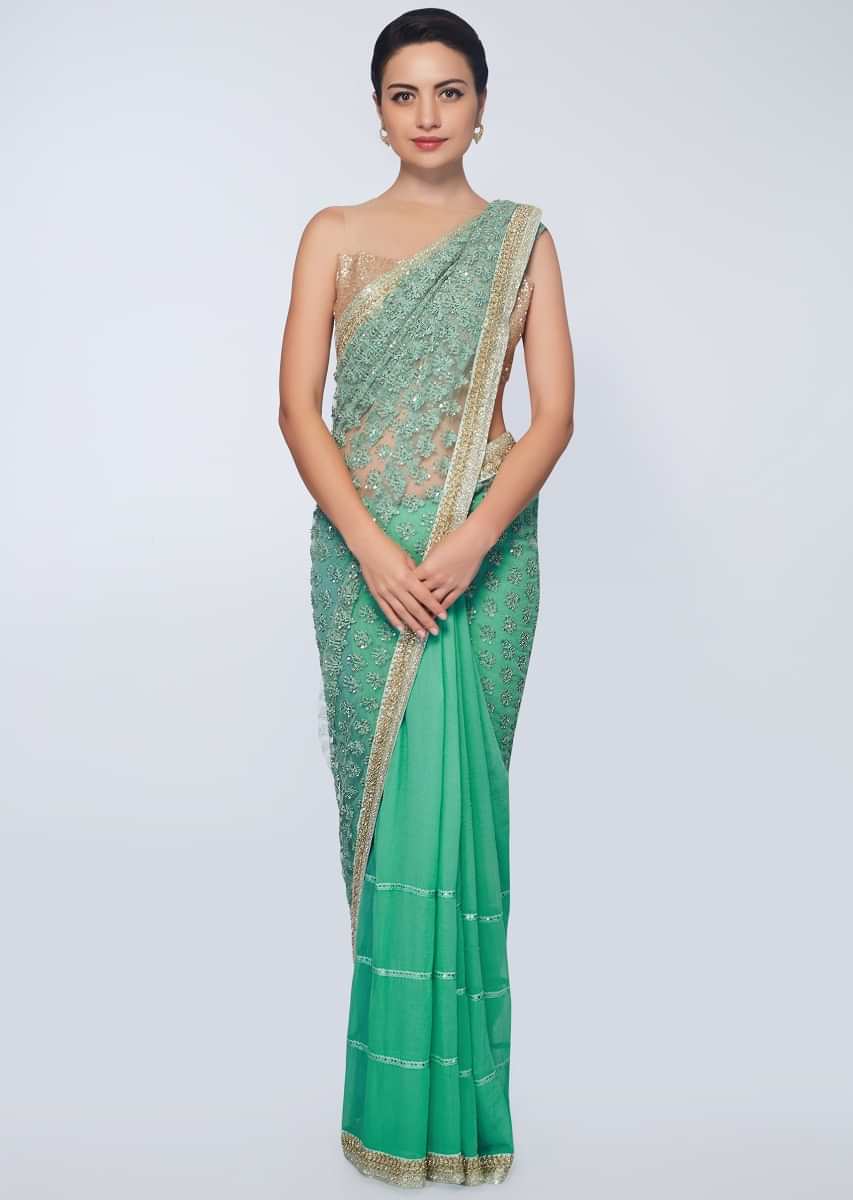 Sea green half and half saree featuring in net and chiffon