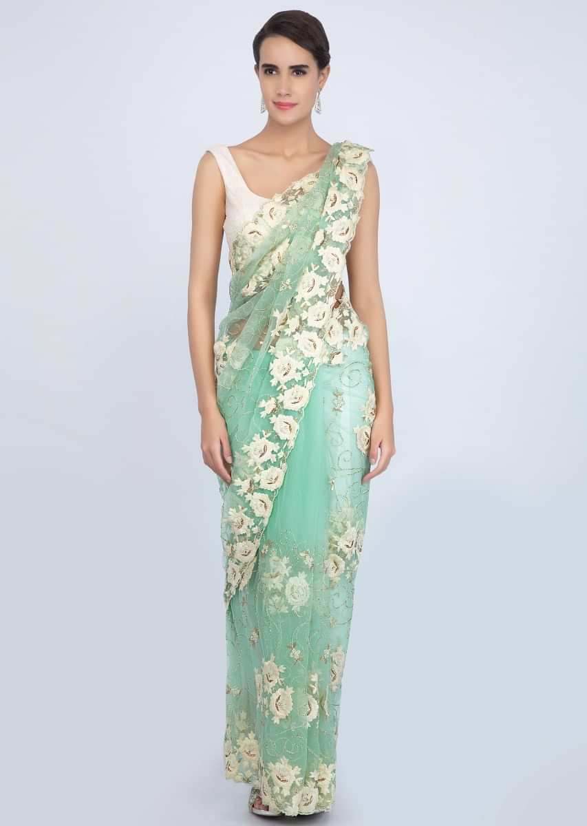 Sea green net saree with jaal embroidery on the lower bottom and pallo only on Kalki
