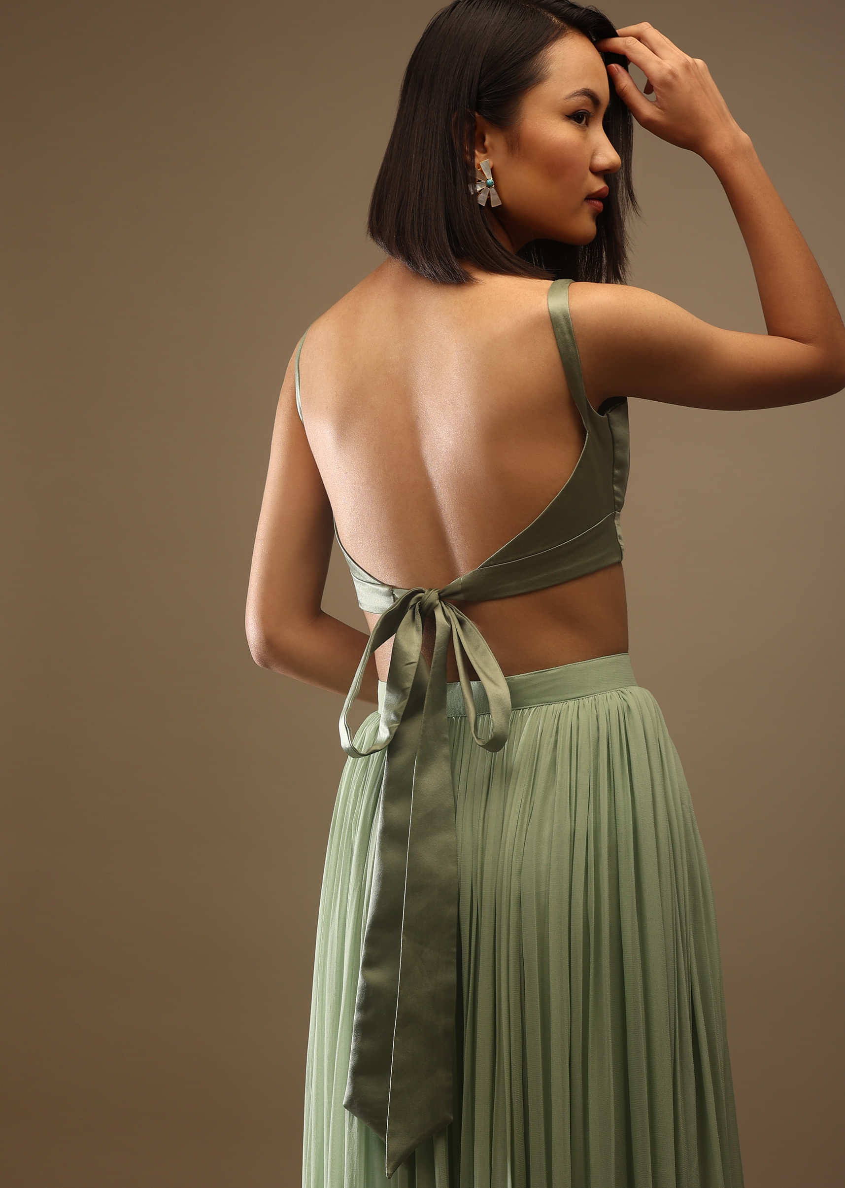 Seaspray Sleeveless Blouse With A Triangle Cut Out At The Bottom Back Tie-Up And Hooks Closure