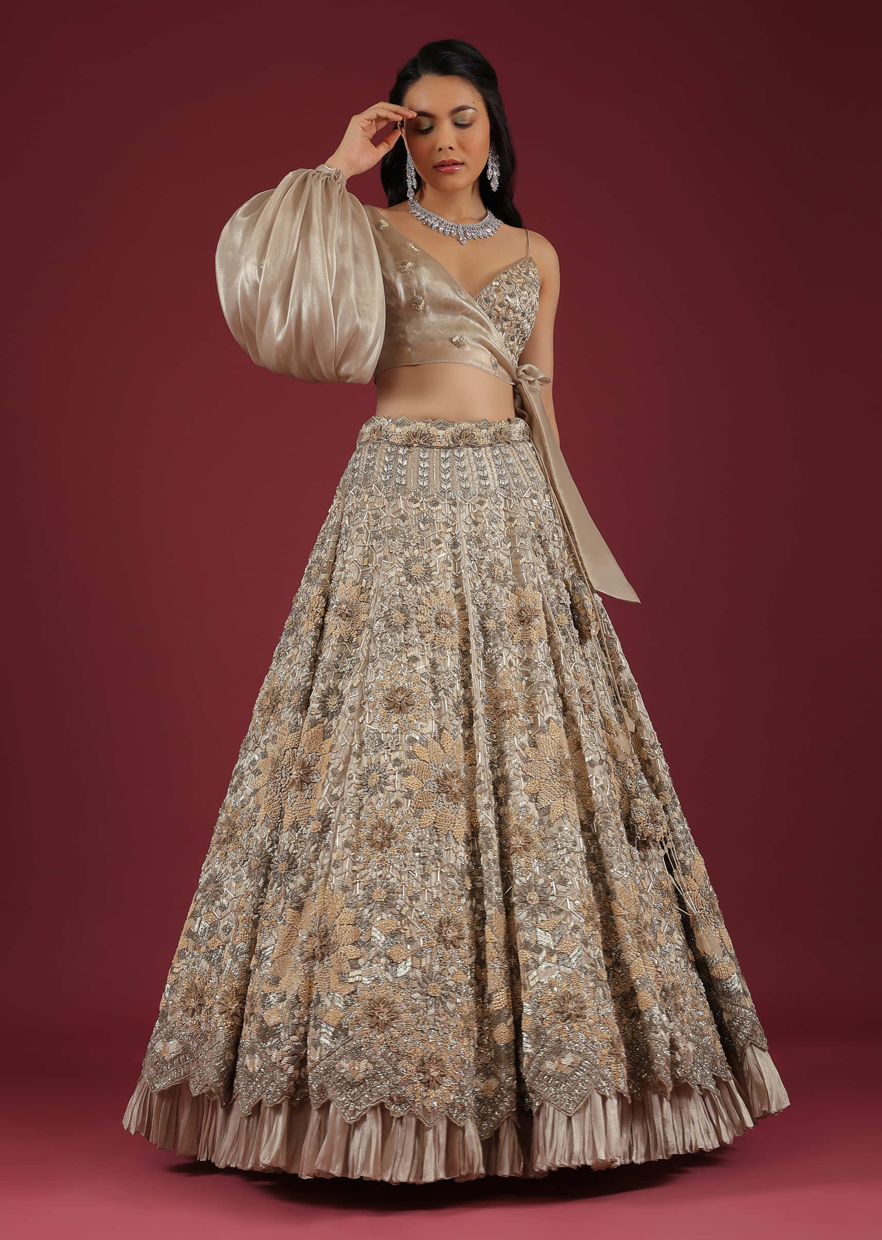 Oyster Lehenga And A Crop Top With One Sided Balloon Sleeves Tie Up Top And Cut Dana Motifs Embroidery