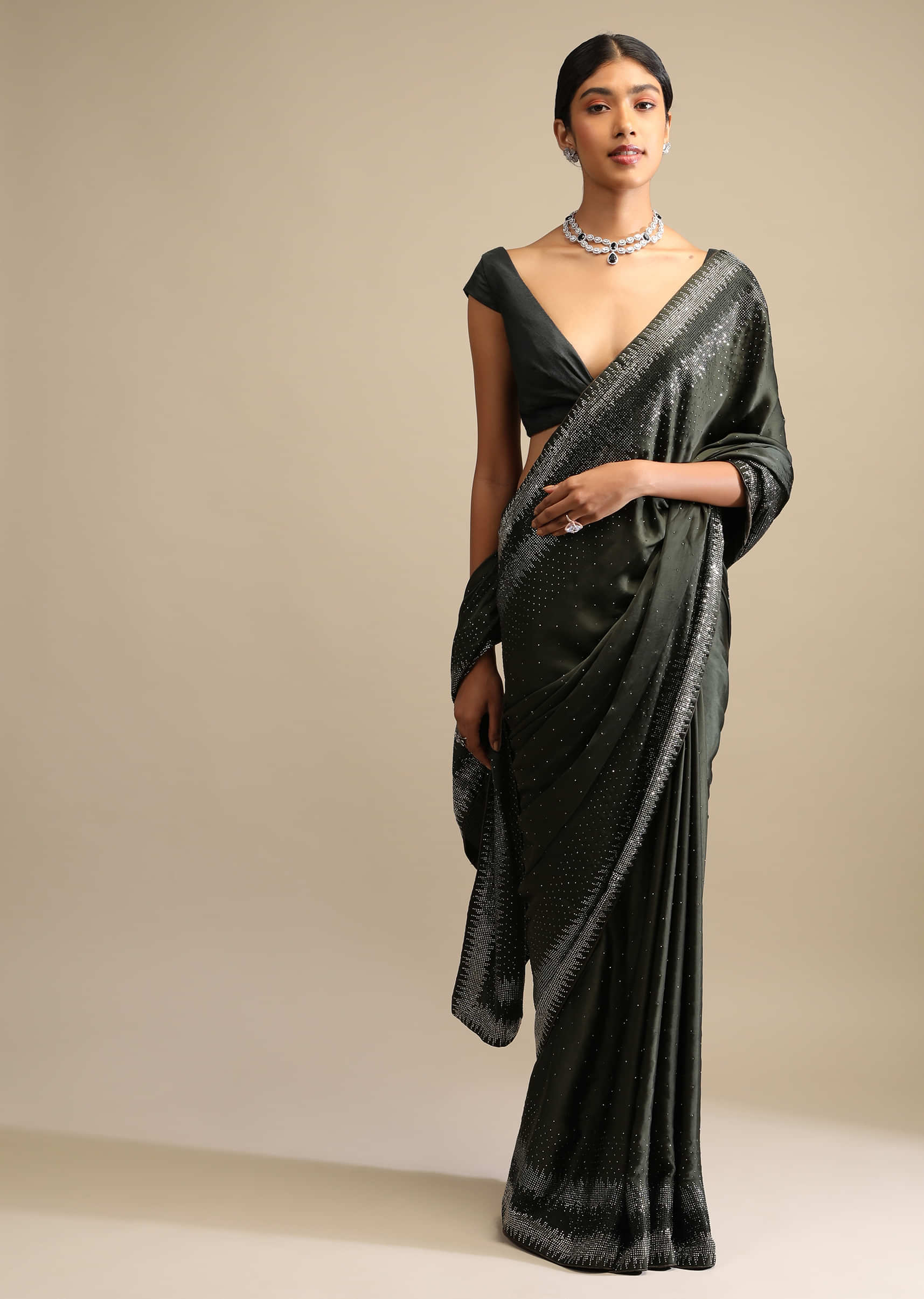 Shadow Green Saree In Satin With Scattered Sequins And Heavy Embellished Border  