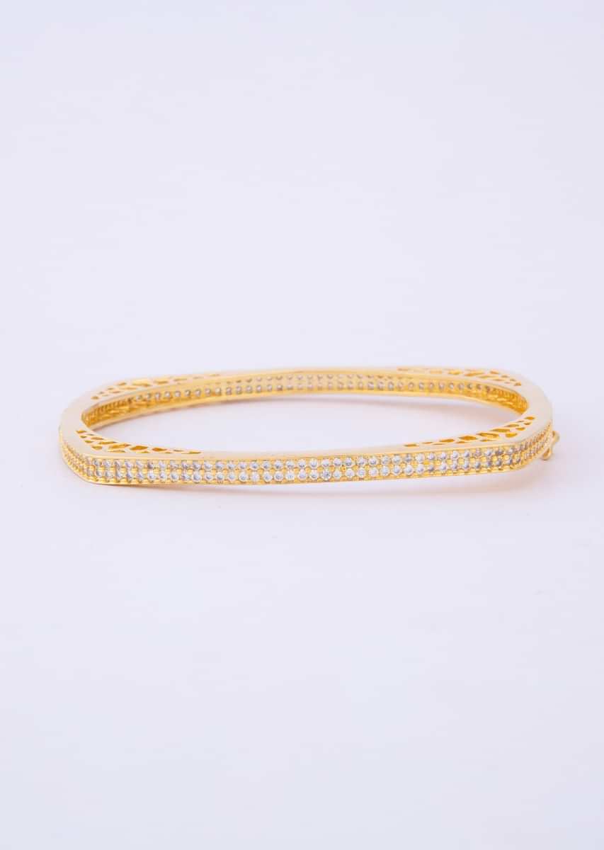 Shiny gold plated bracelet with stone studded edges only on Kalki