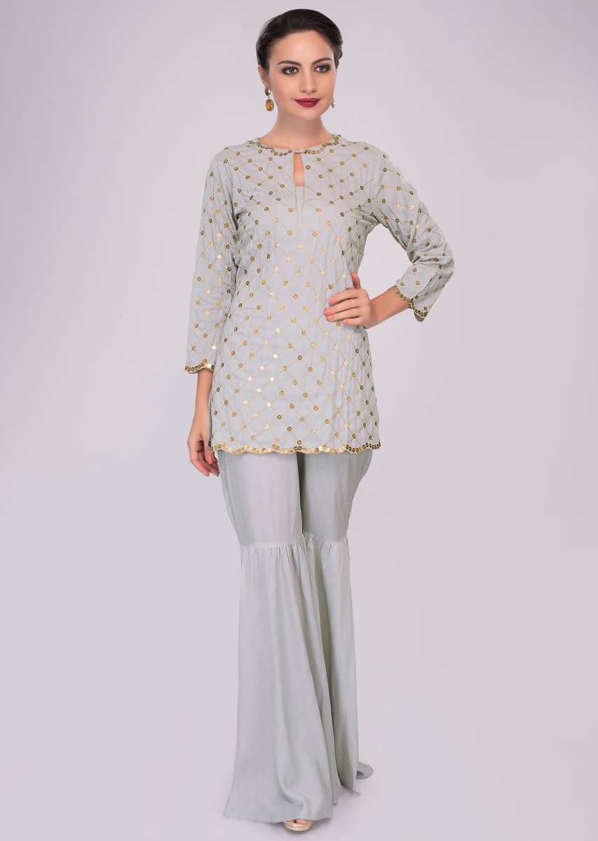 Silver grey cotton sharara paired with matching suit in thread and sequins jaal work 
