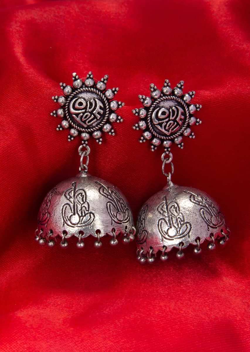 Silver metal coated oxidized jhumkas with human carving  only on kalki