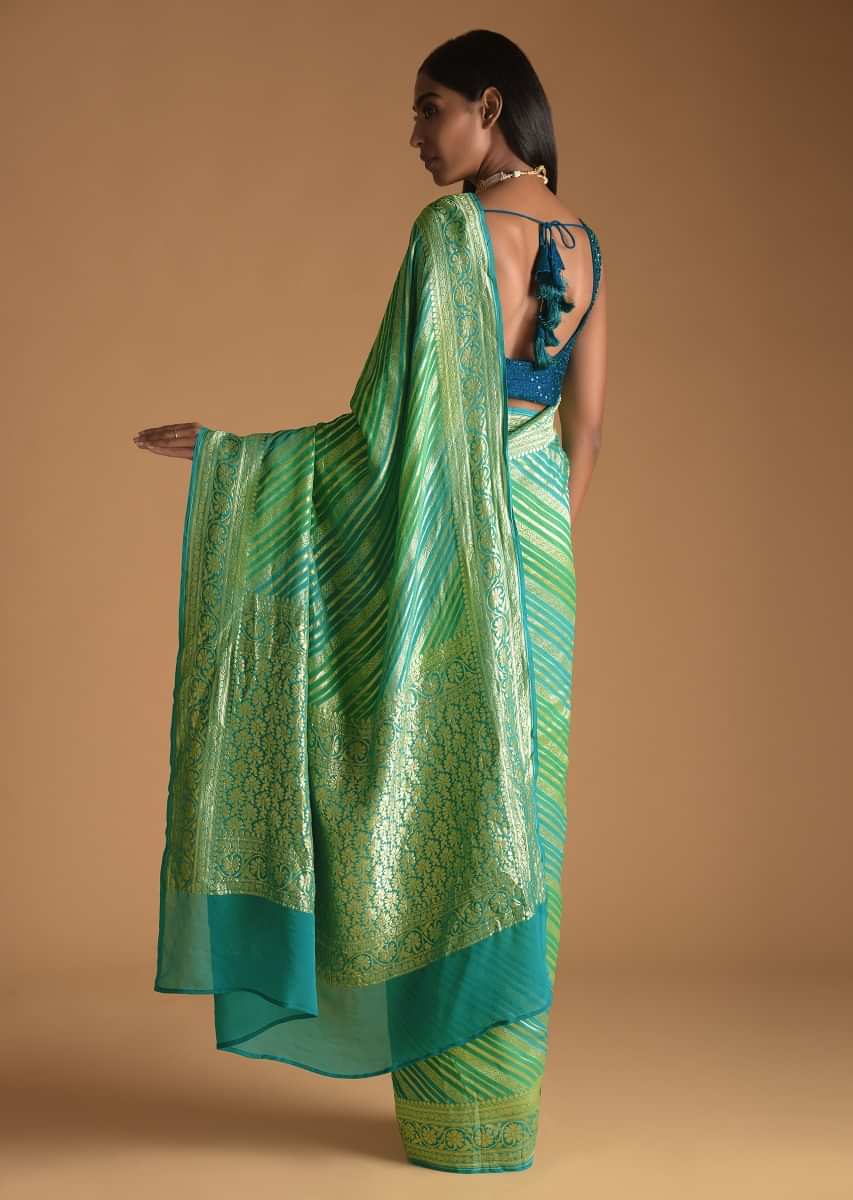Sky Blue And Green Shaded Saree In Georgette With Woven Stripes And Floral Design On The Pallu  