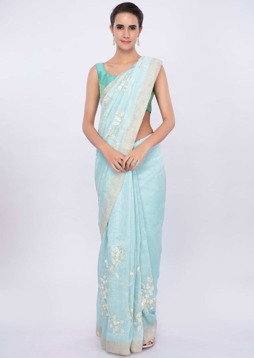 Sky blue linen saree in sequins and cut dana embroidery only on Kalki