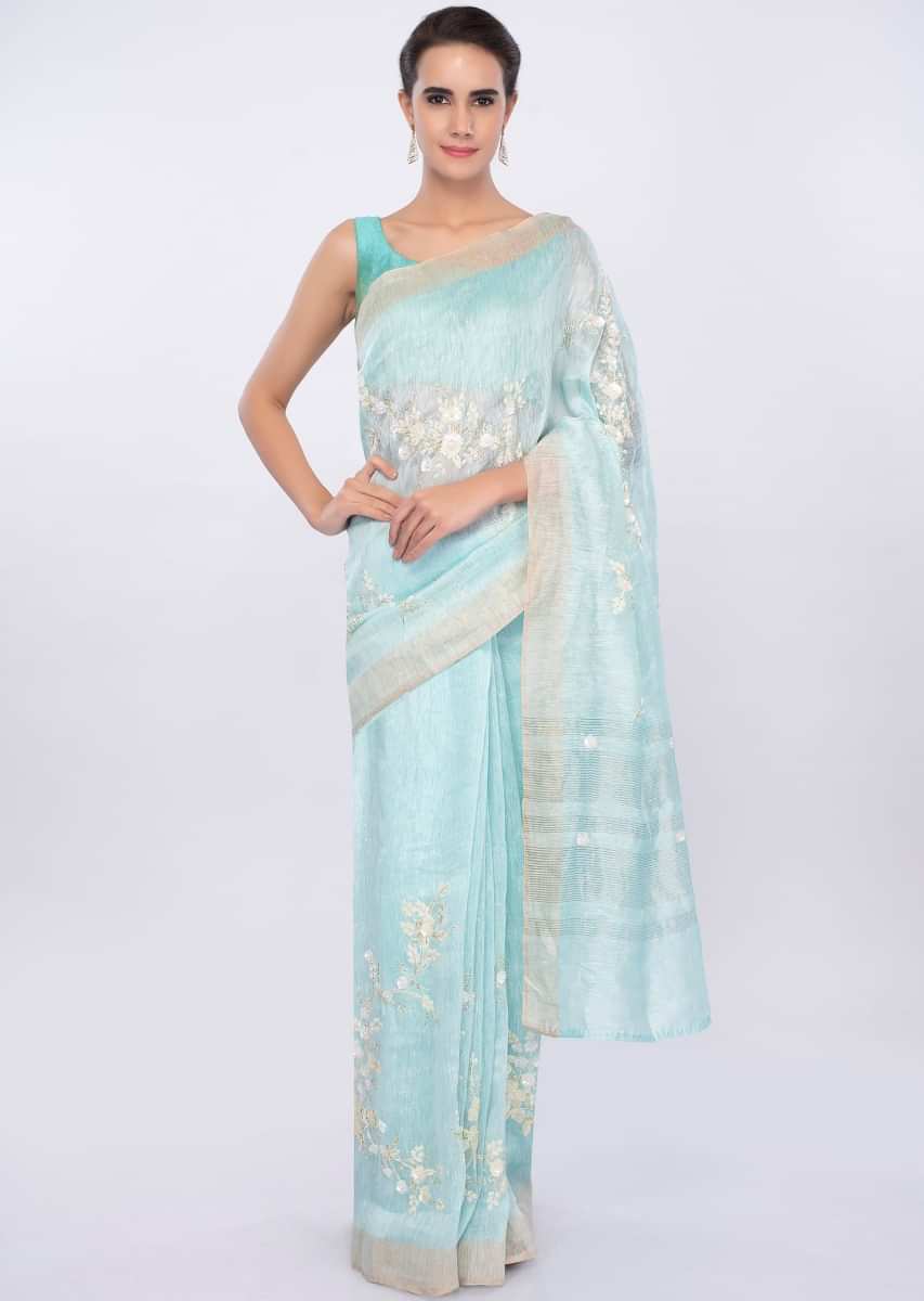 Sky blue linen saree in sequins and cut dana embroidery only on Kalki