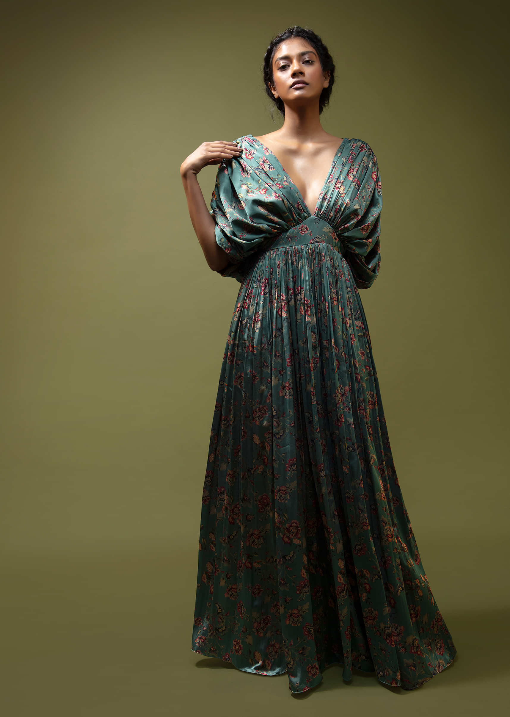 Steel Blue Gown In Satin With Floral Print And Fancy Gathered Sleeves With Adjustable Tassel Dori And Plunging Neckline