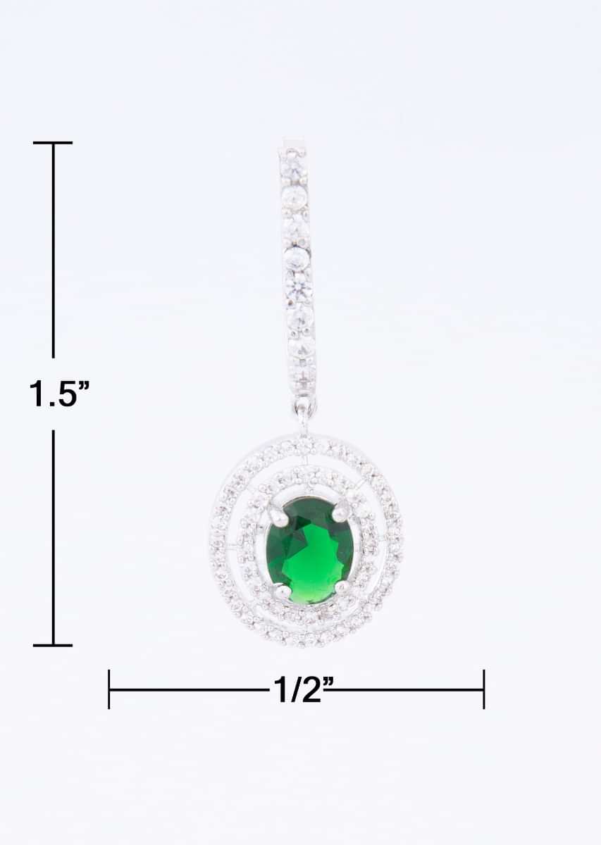 Stone studded diamond dangler with emerald green  stone at the center only on Kalki