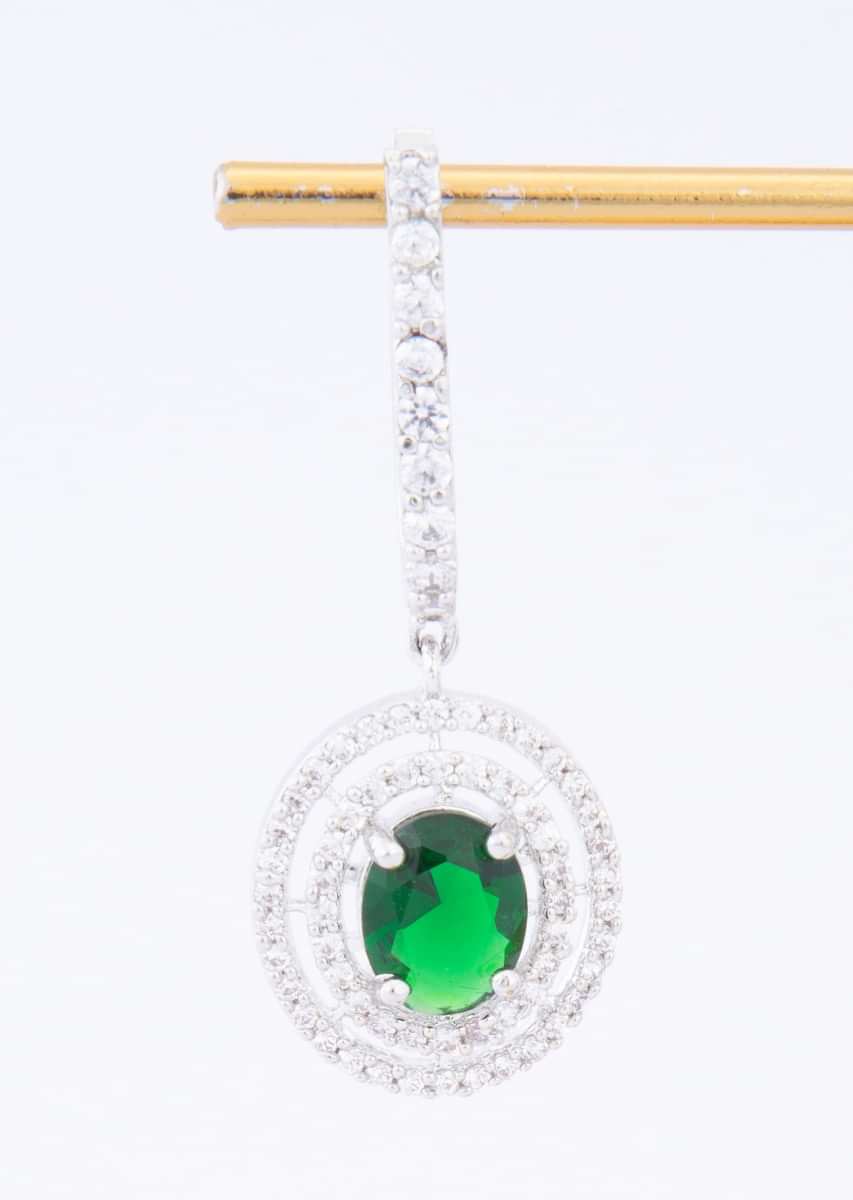Stone studded diamond dangler with emerald green  stone at the center only on Kalki